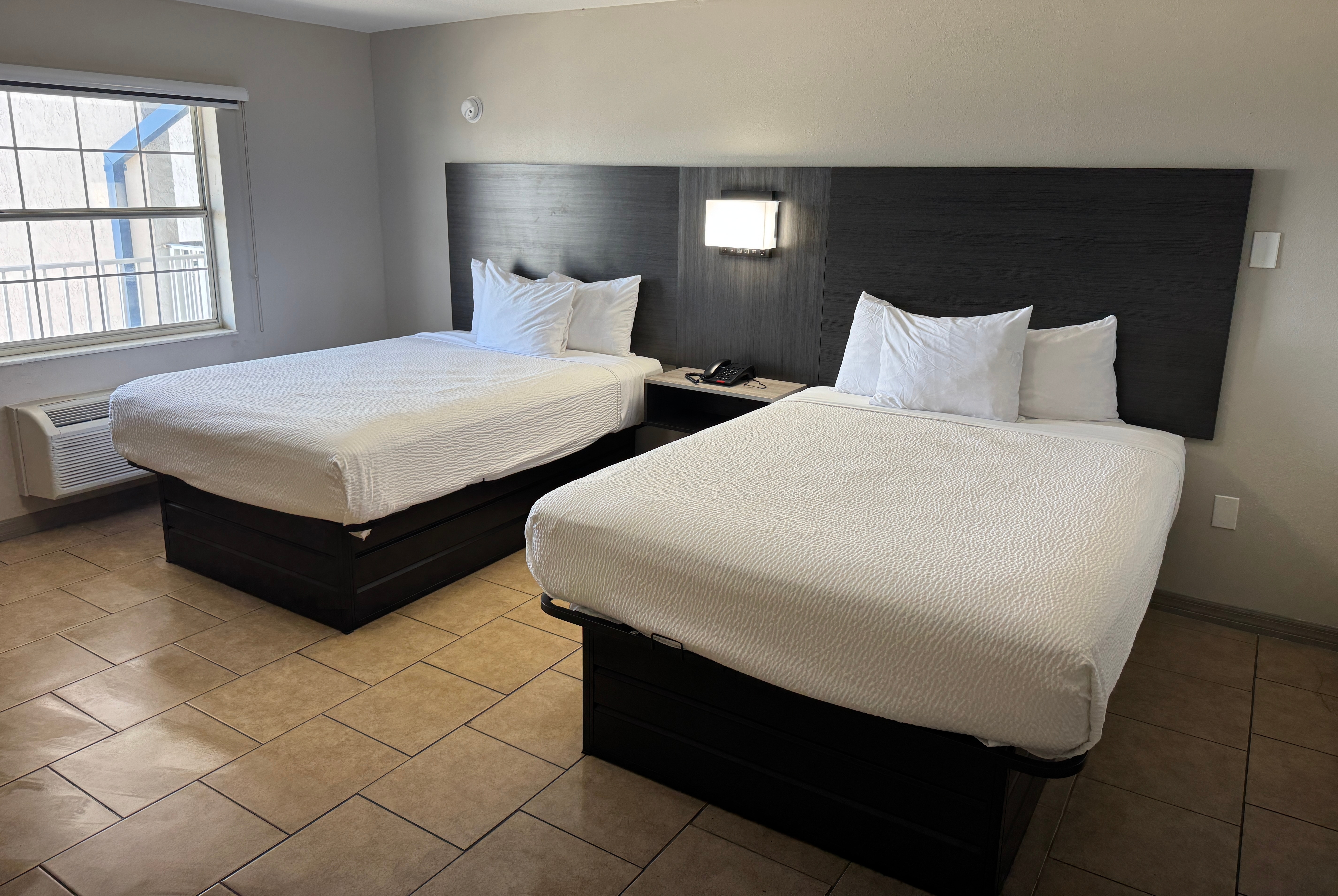 Guest room at the Travelodge by Wyndham Venice in Venice, Florida