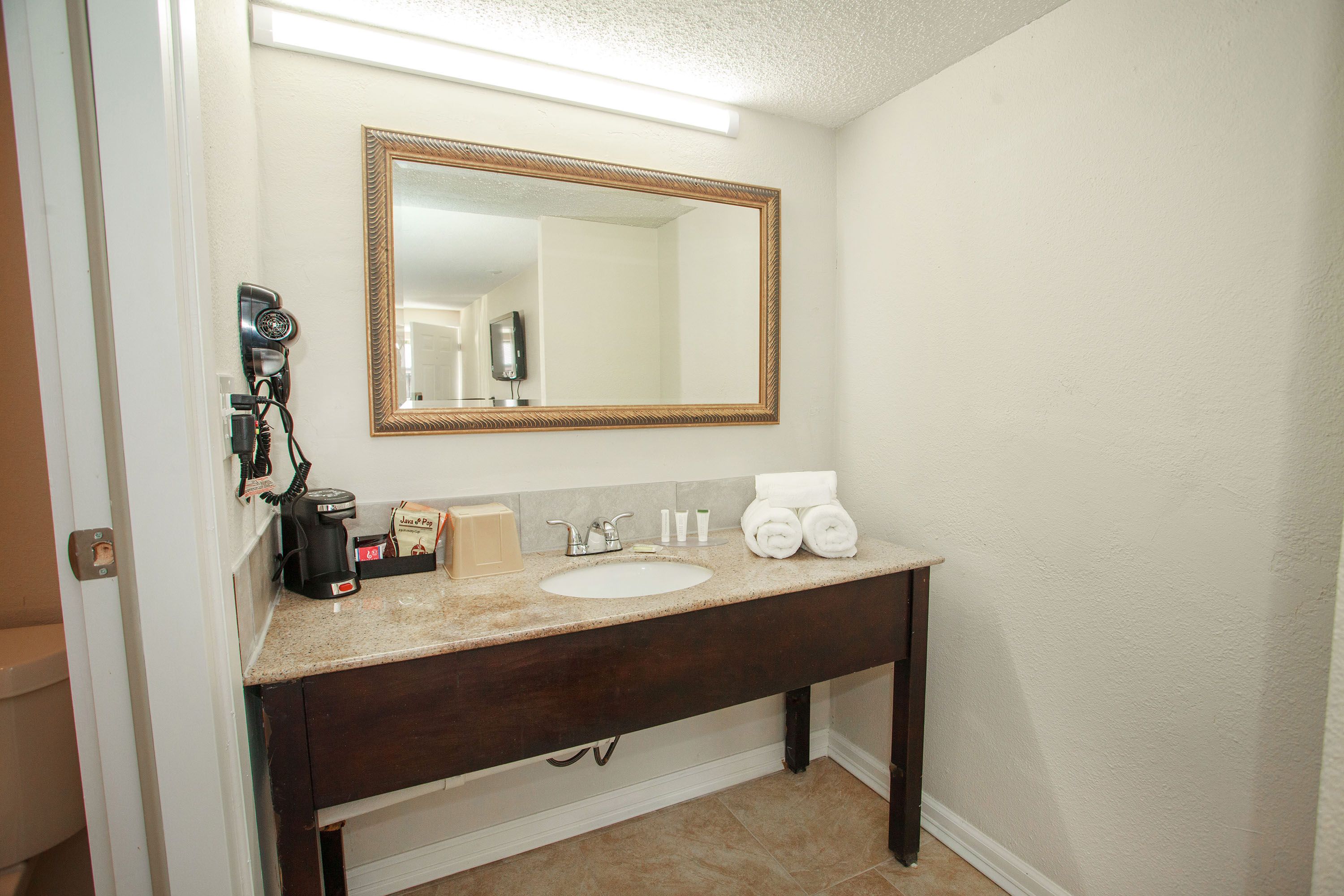 Guest room bath at the Travelodge by Wyndham Macon West in Macon, Georgia