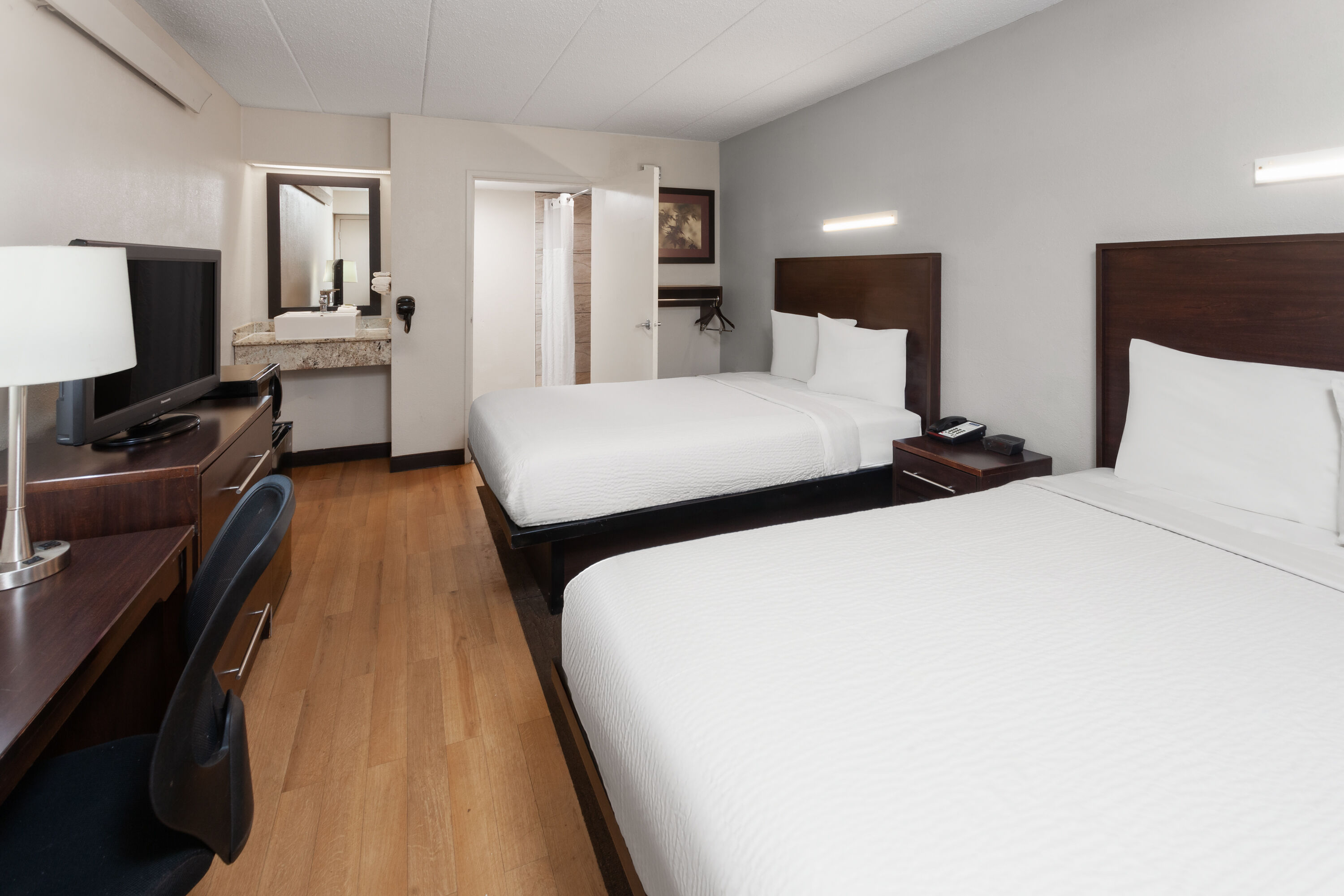 Guest room at the Travelodge by Wyndham Peoria in Peoria, Illinois