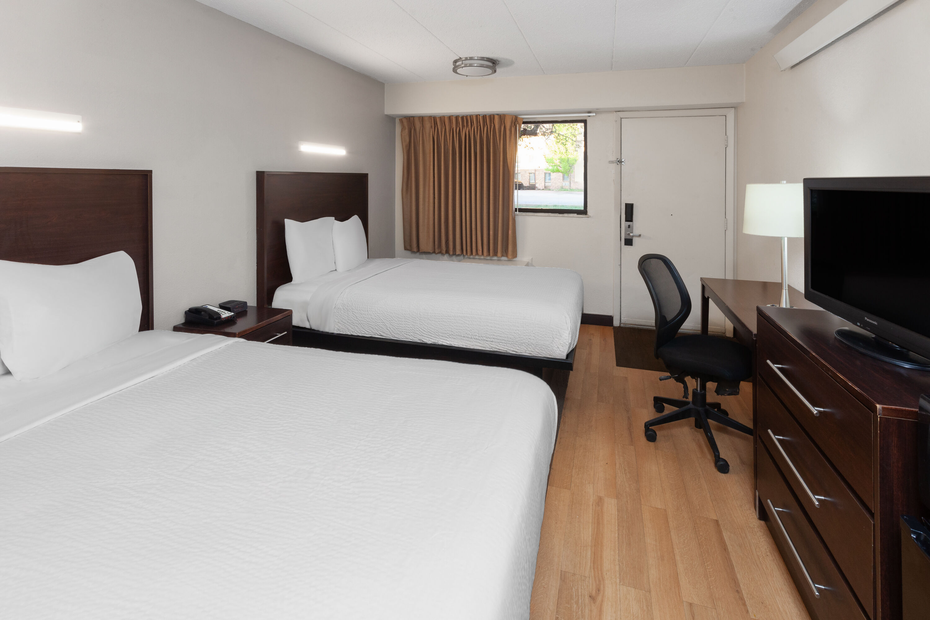 Guest room at the Travelodge by Wyndham Peoria in Peoria, Illinois