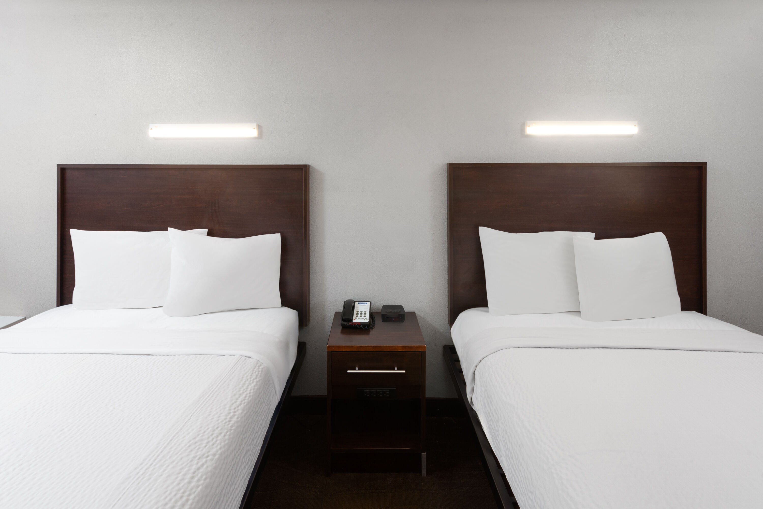 Guest room at the Travelodge by Wyndham Peoria in Peoria, Illinois