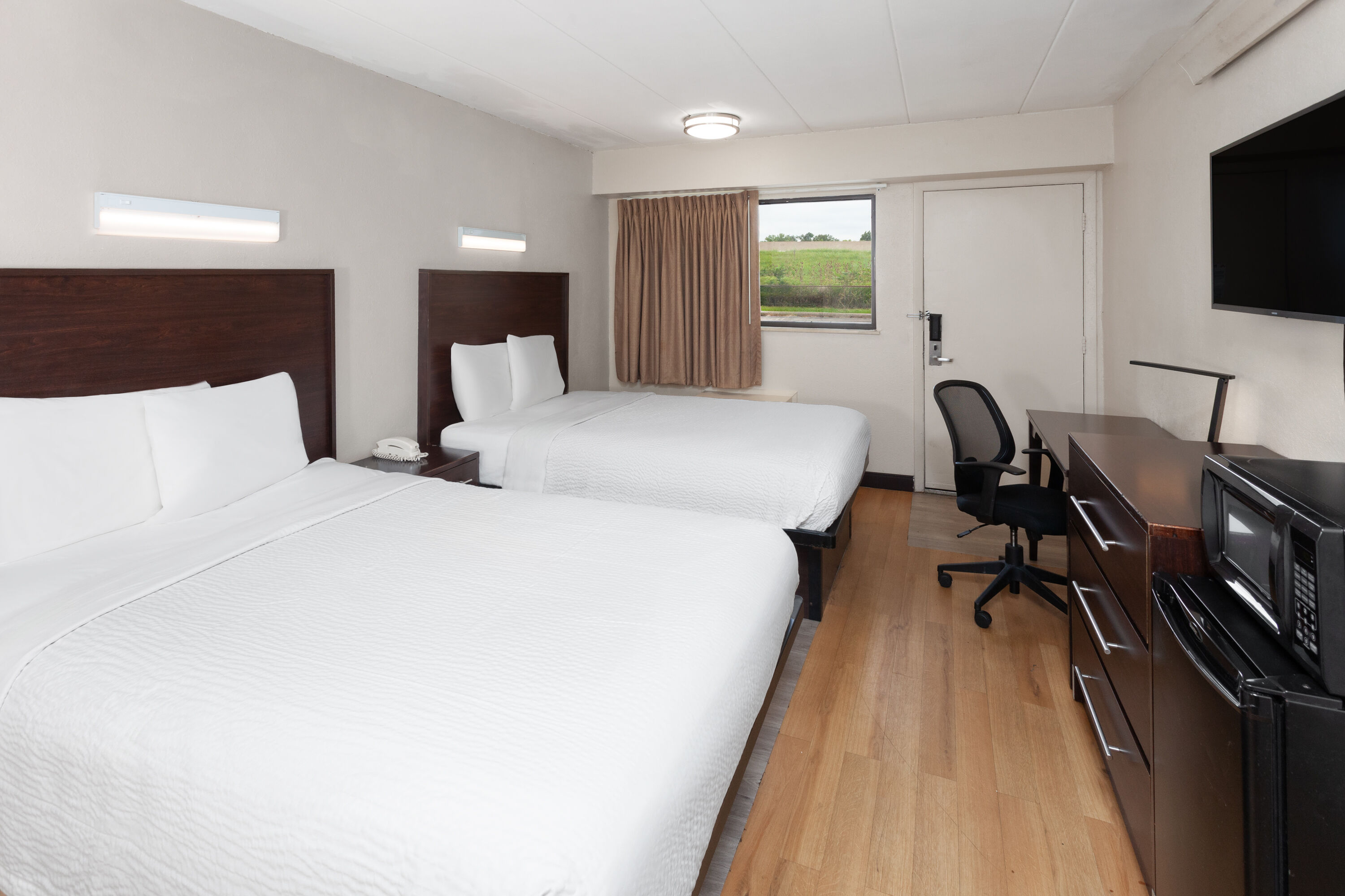 Guest room at the Travelodge by Wyndham Peoria in Peoria, Illinois