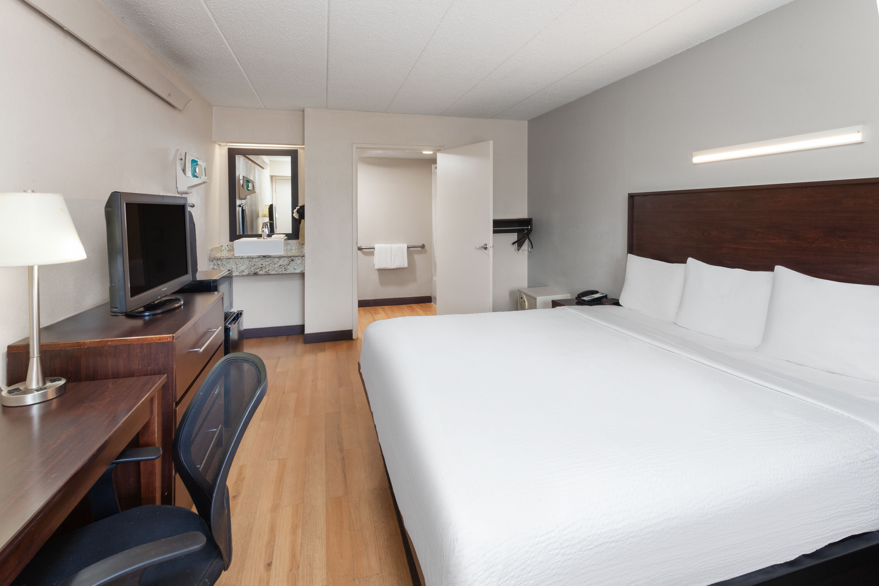 Guest room at the Travelodge by Wyndham Peoria in Peoria, Illinois