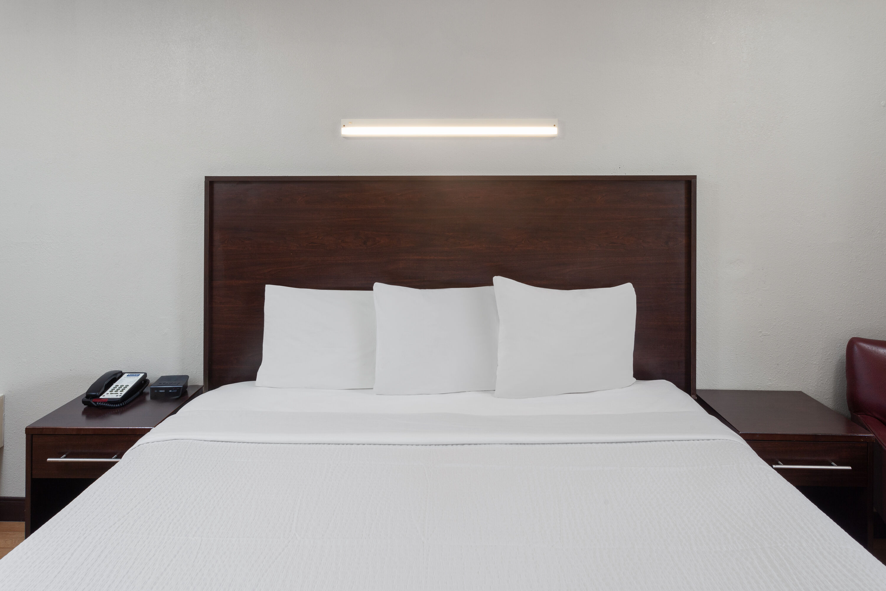 Guest room at the Travelodge by Wyndham Peoria in Peoria, Illinois