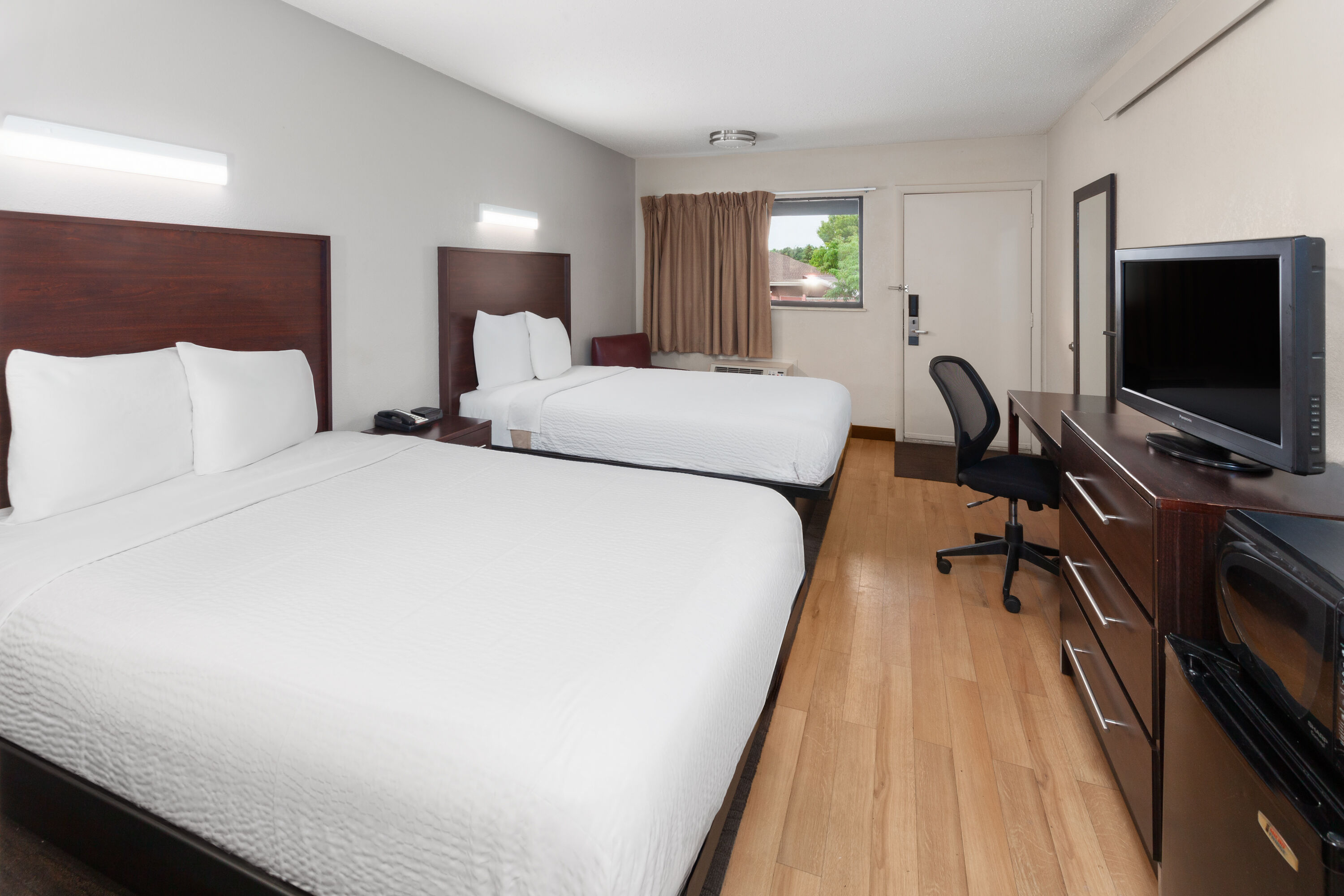 Guest room at the Travelodge by Wyndham Peoria in Peoria, Illinois
