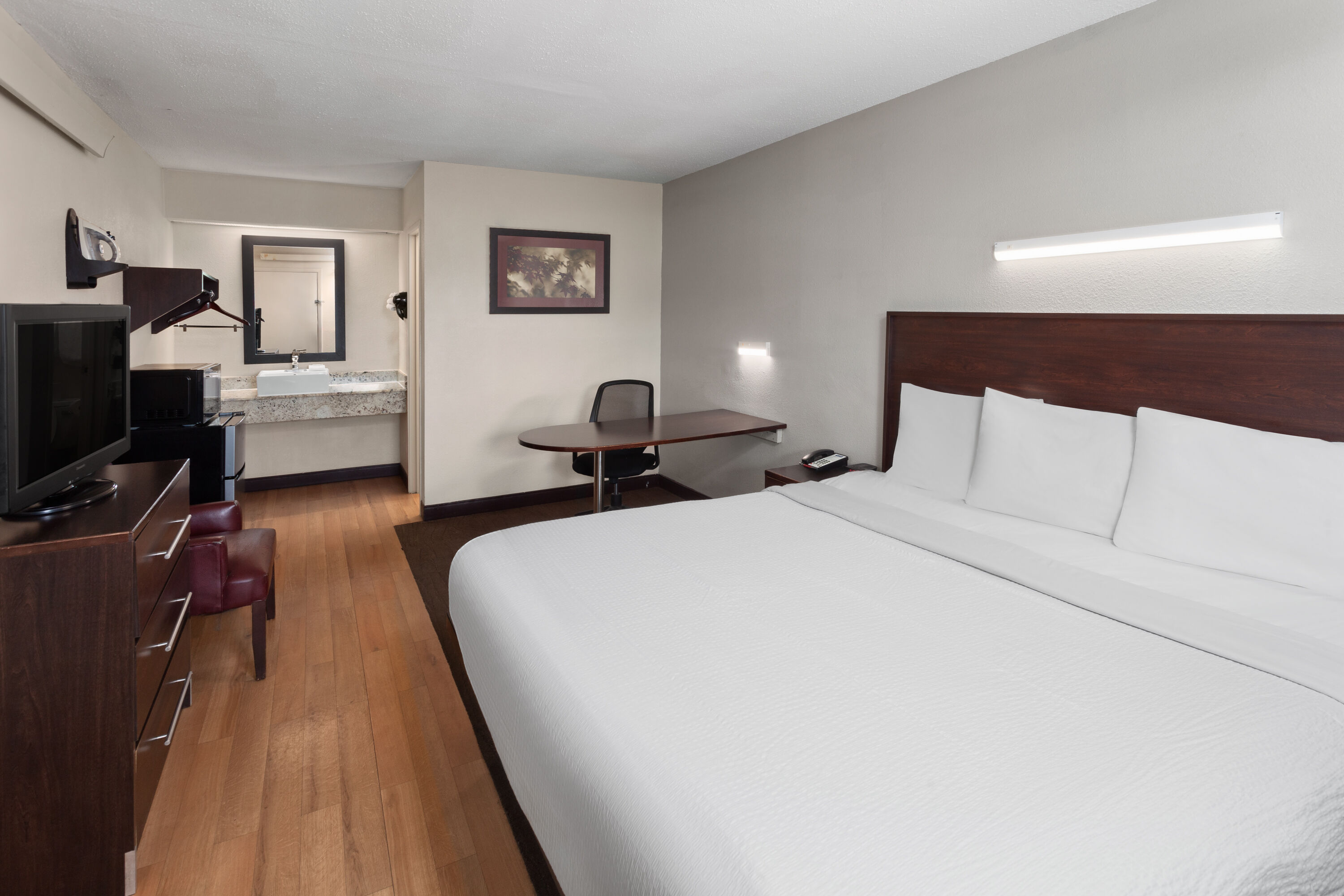 Guest room at the Travelodge by Wyndham Peoria in Peoria, Illinois