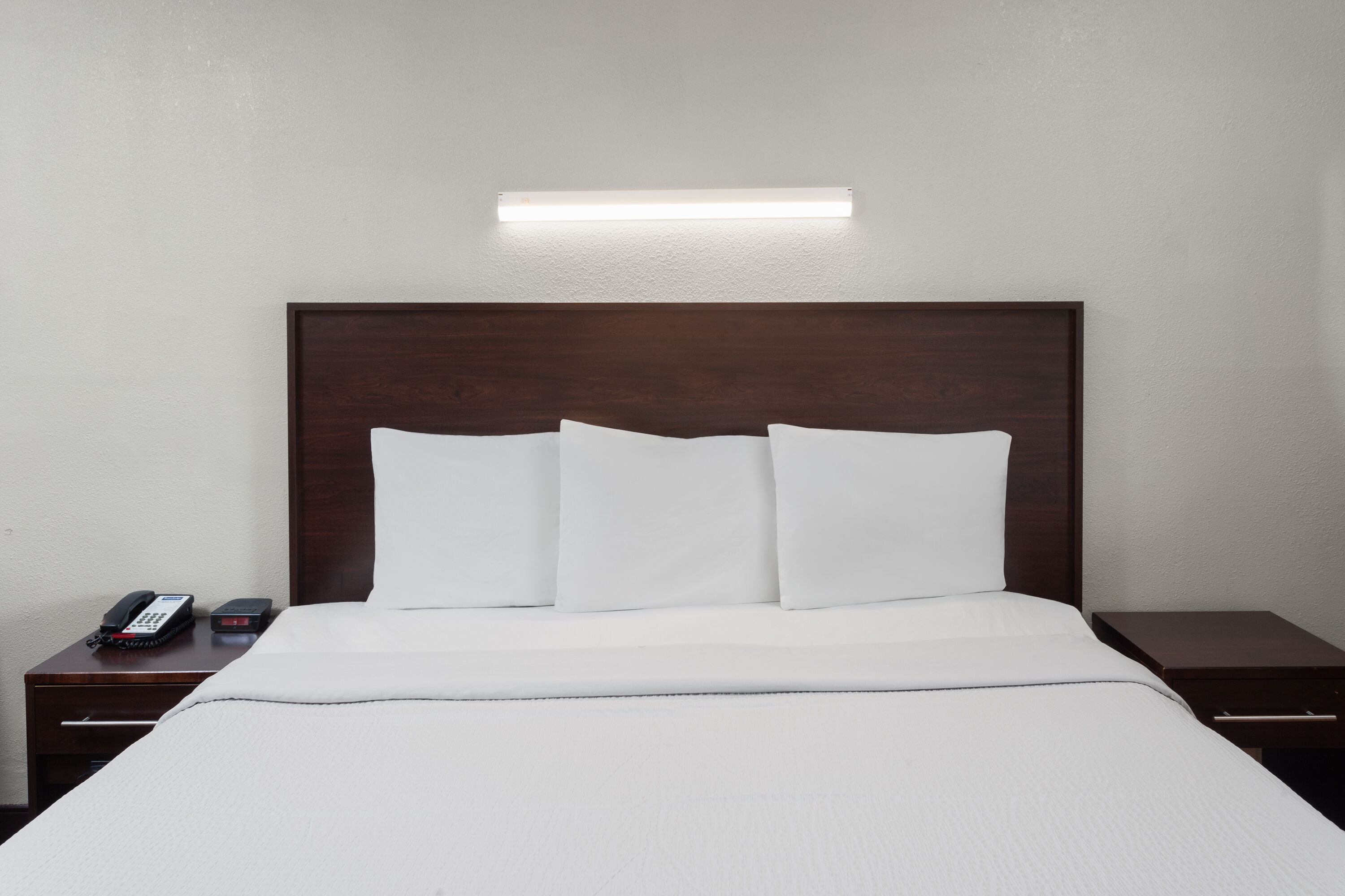 Guest room at the Travelodge by Wyndham Peoria in Peoria, Illinois