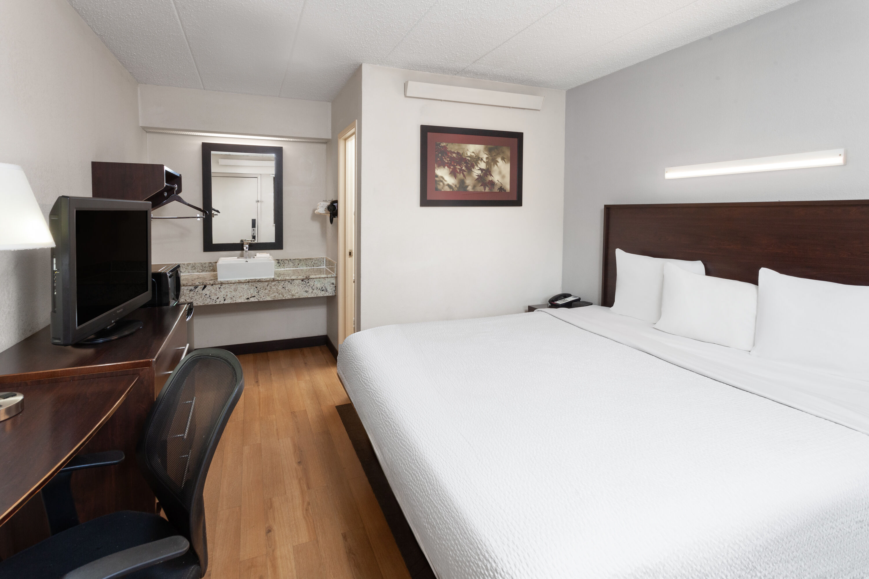 Guest room at the Travelodge by Wyndham Peoria in Peoria, Illinois