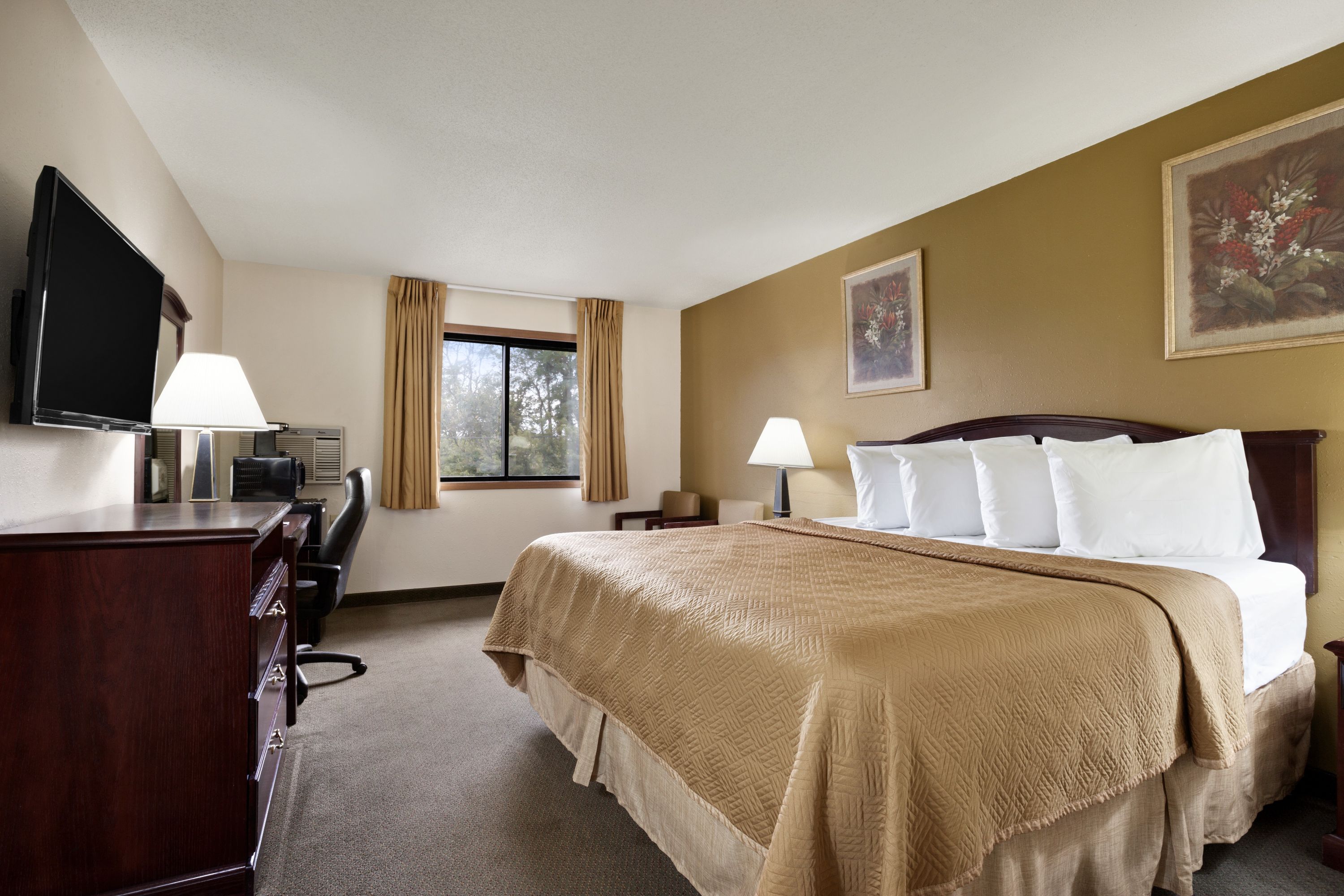 Guest room at the Travelodge by Wyndham La Porte/Michigan City Area in LaPorte, Indiana