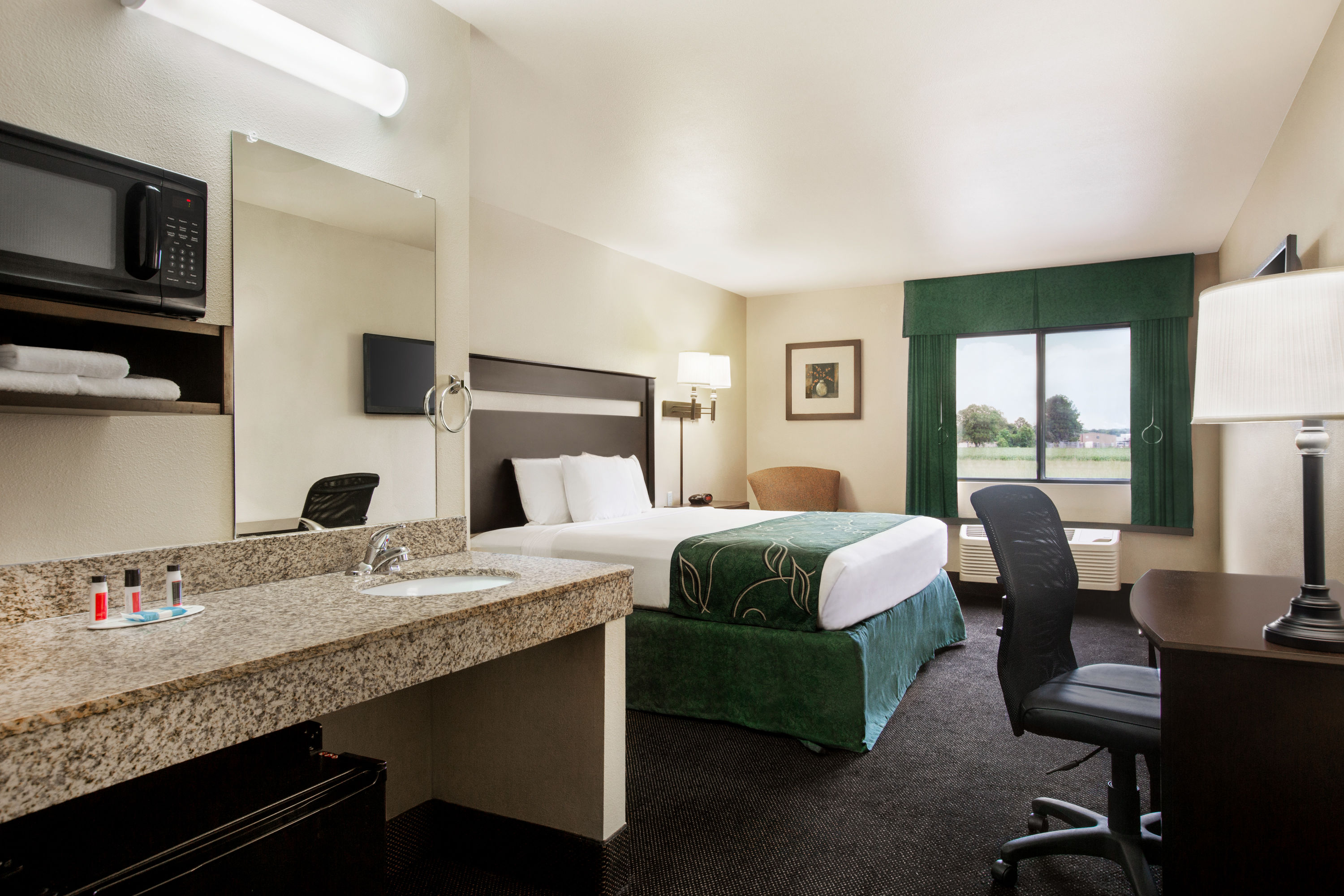 Guest room at the Travelodge by Wyndham Livonia in Livonia, Louisiana
