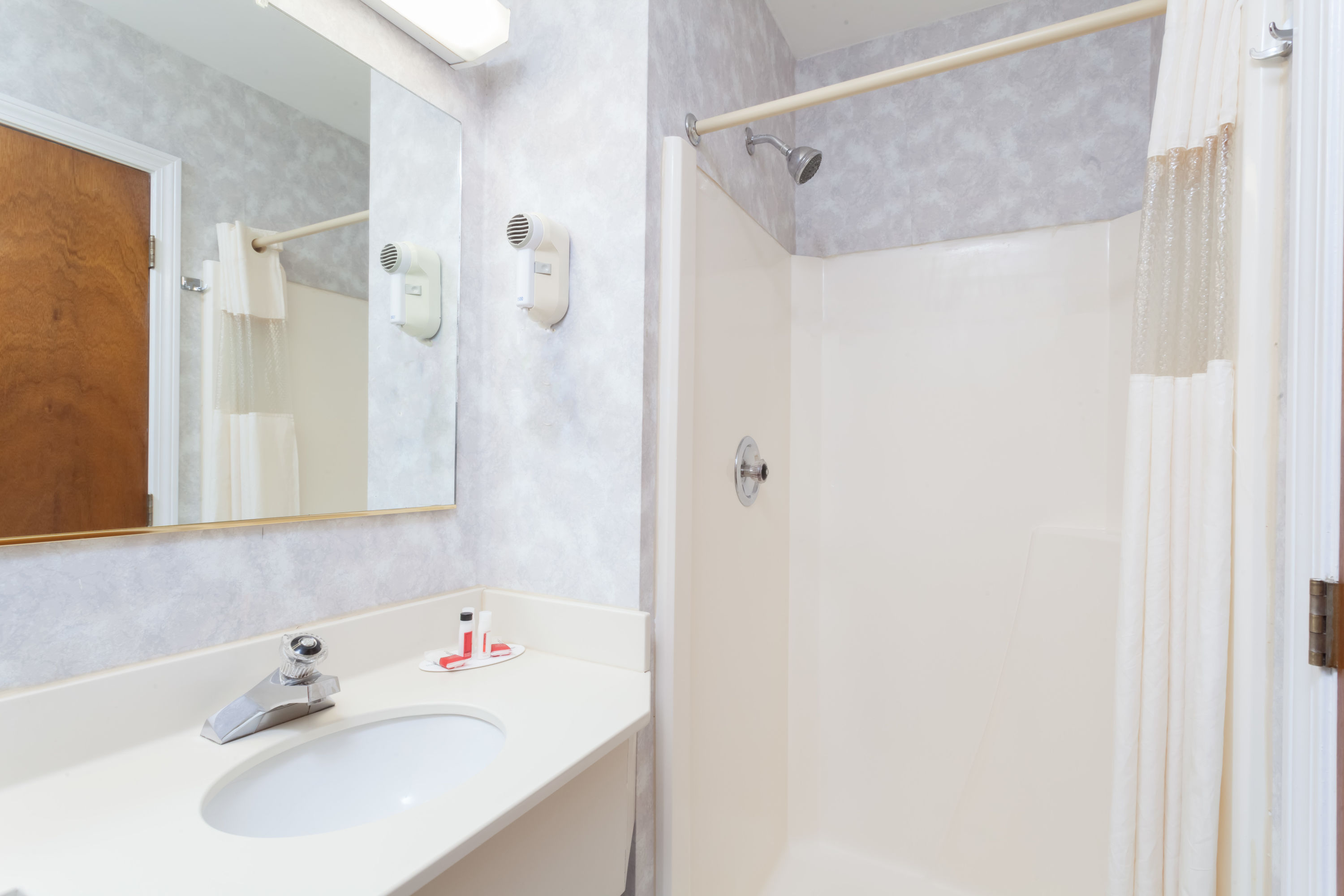 Guest room bath at the Travelodge by Wyndham Great Barrington Berkshires in Great Barrington, Massachusetts