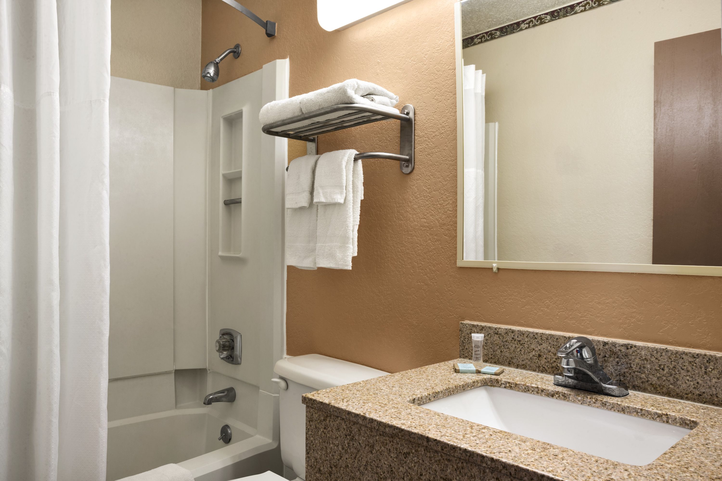 Guest room at the Travelodge by Wyndham Battle Creek in Battle Creek, Michigan