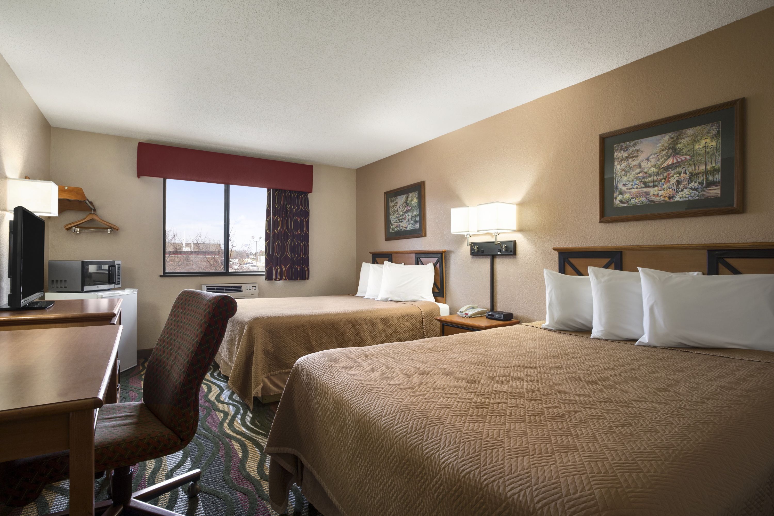 Guest room at the Travelodge by Wyndham Battle Creek in Battle Creek, Michigan