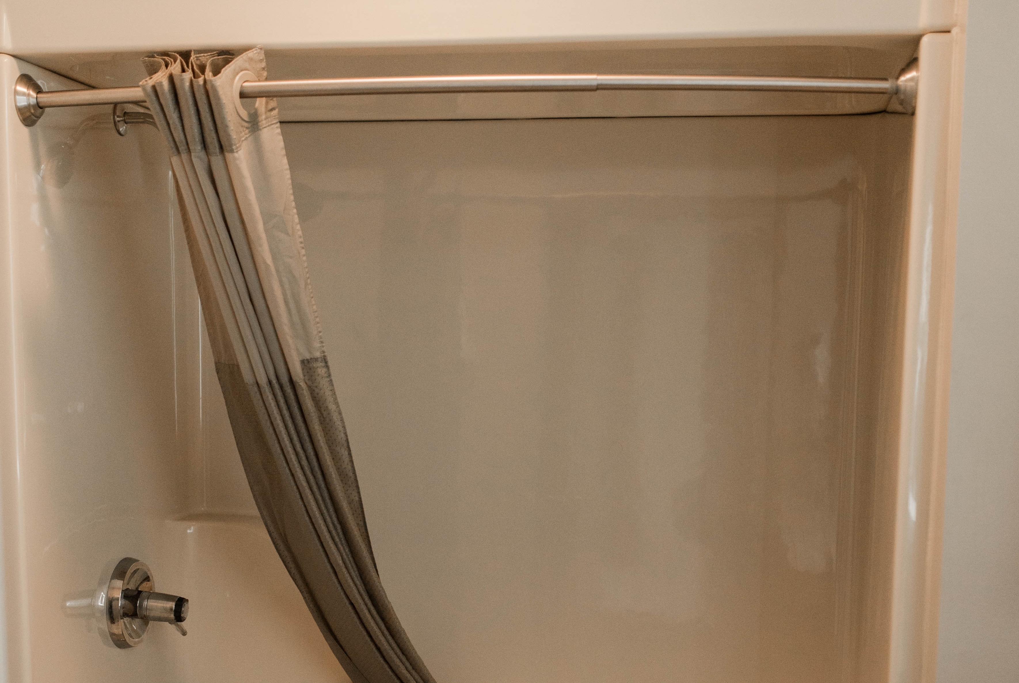 Guest room bath at the Travelodge by Wyndham Escanaba in Escanaba, Michigan