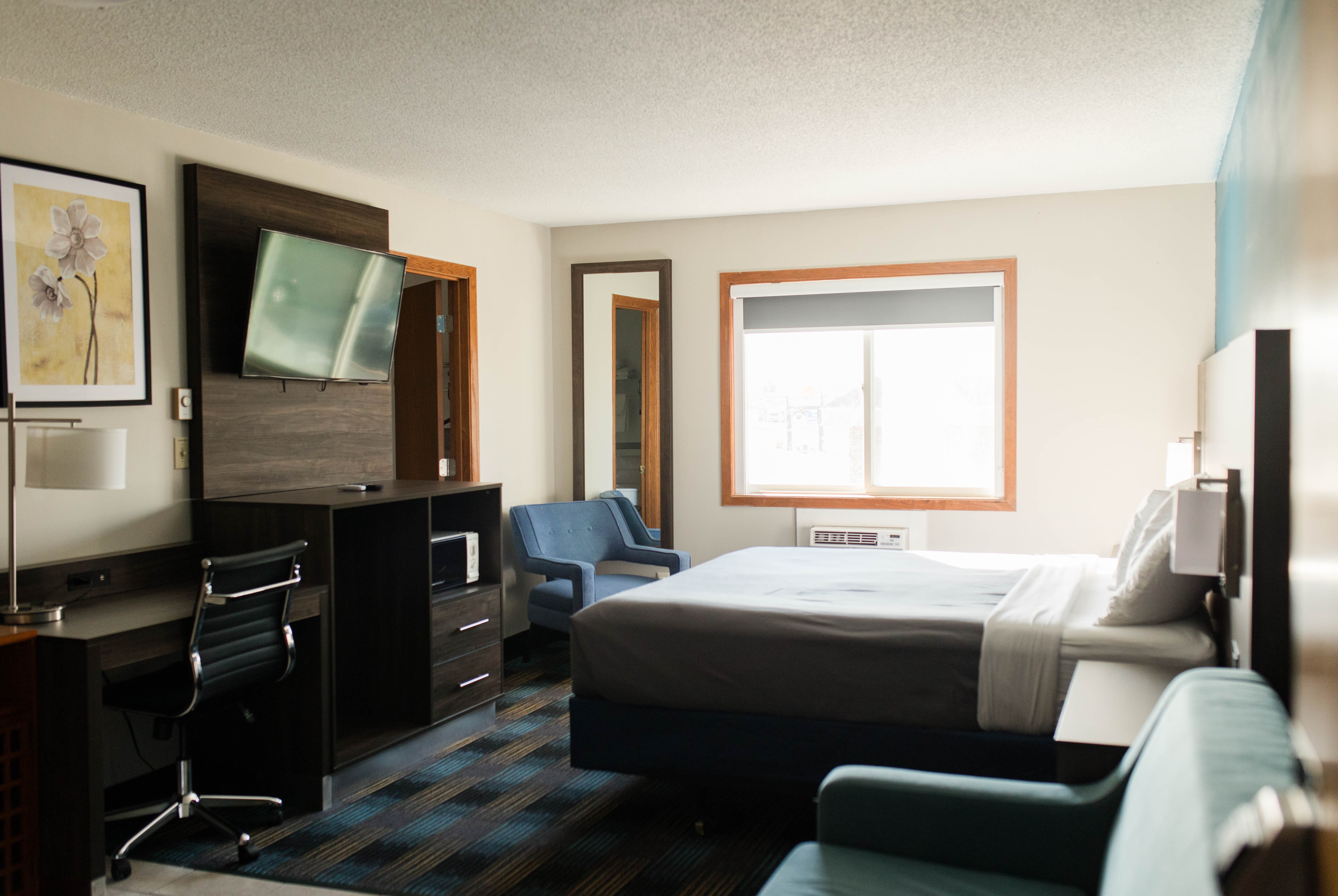 Guest room at the Travelodge by Wyndham Escanaba in Escanaba, Michigan