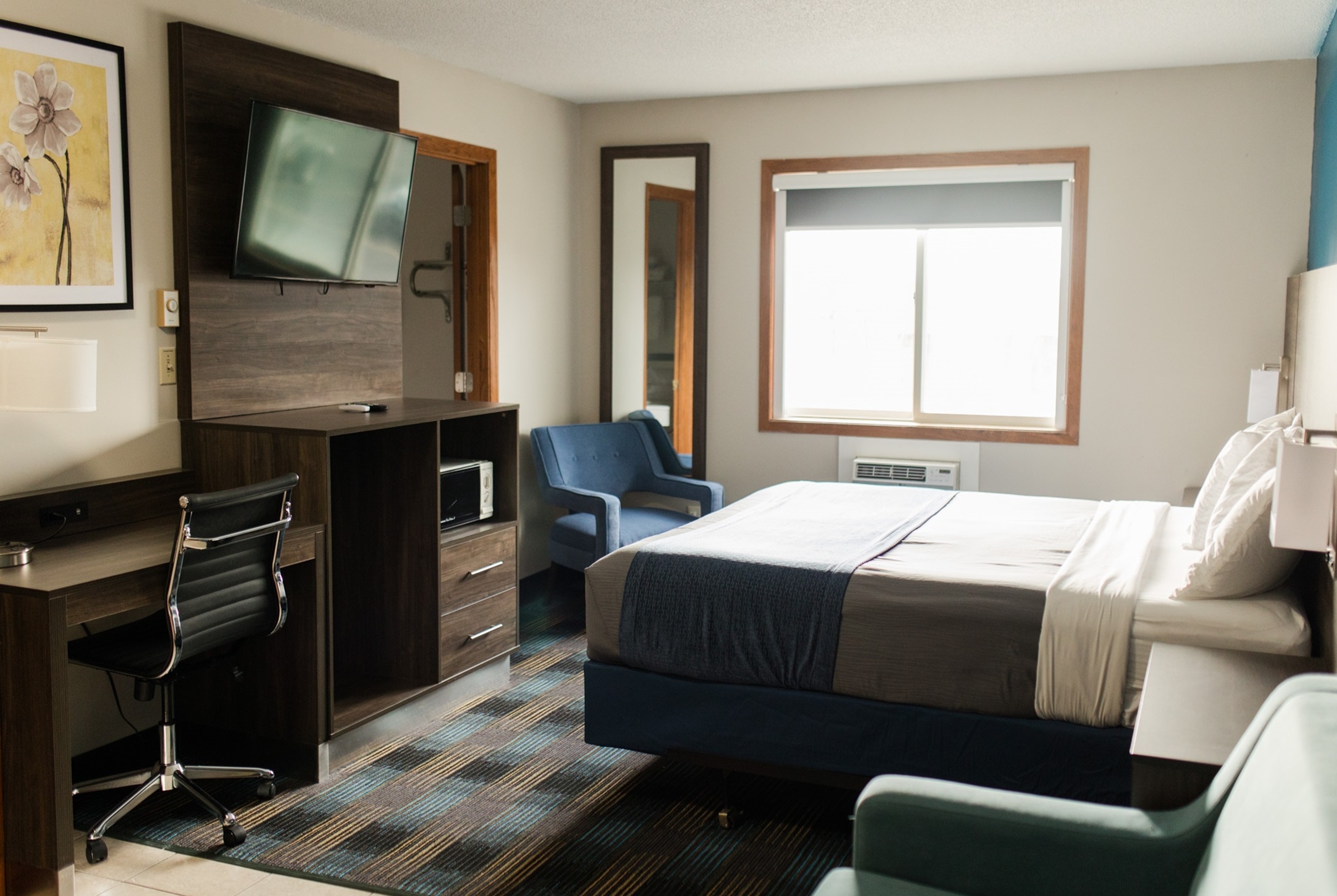 Guest room at the Travelodge by Wyndham Escanaba in Escanaba, Michigan
