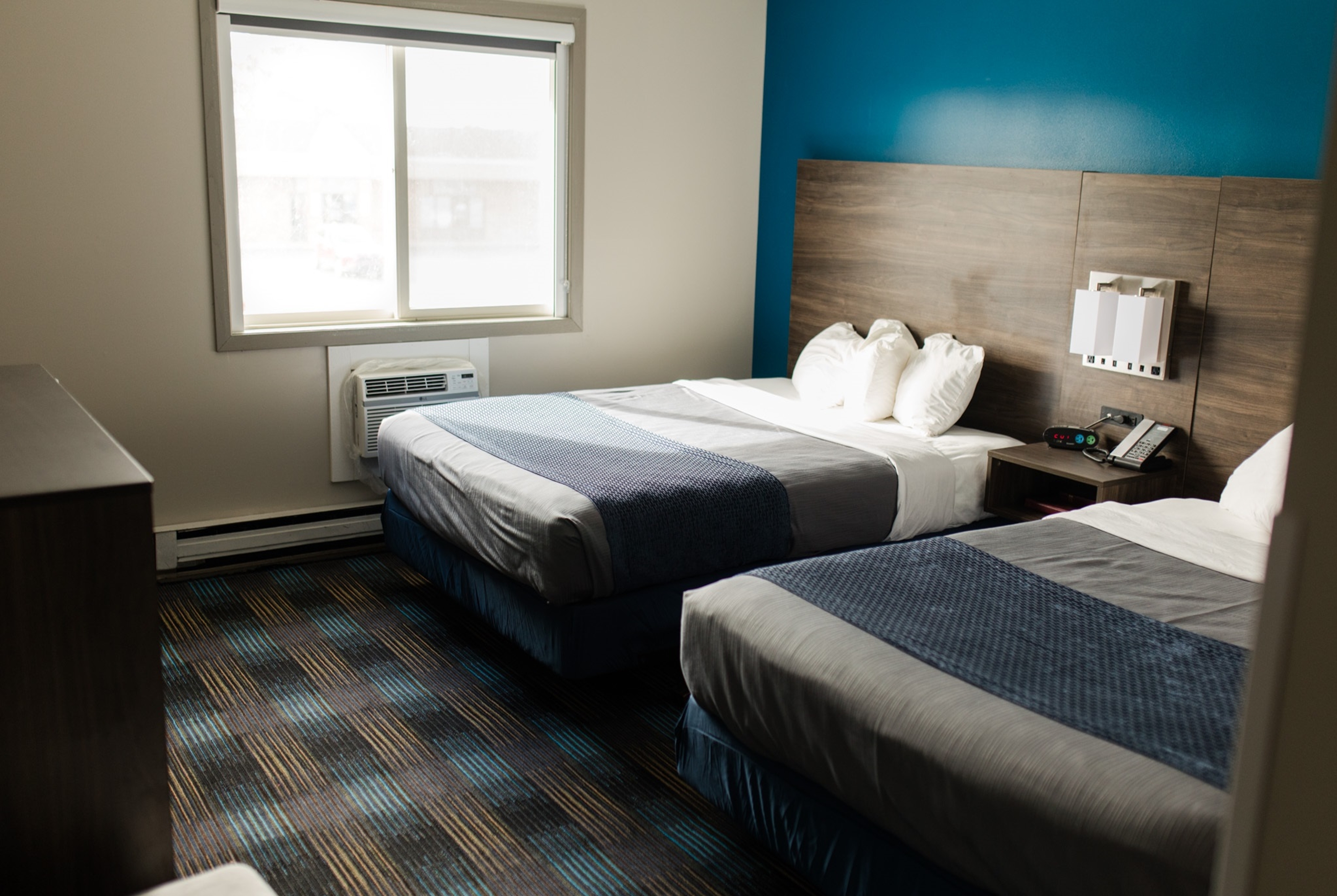Guest room at the Travelodge by Wyndham Escanaba in Escanaba, Michigan