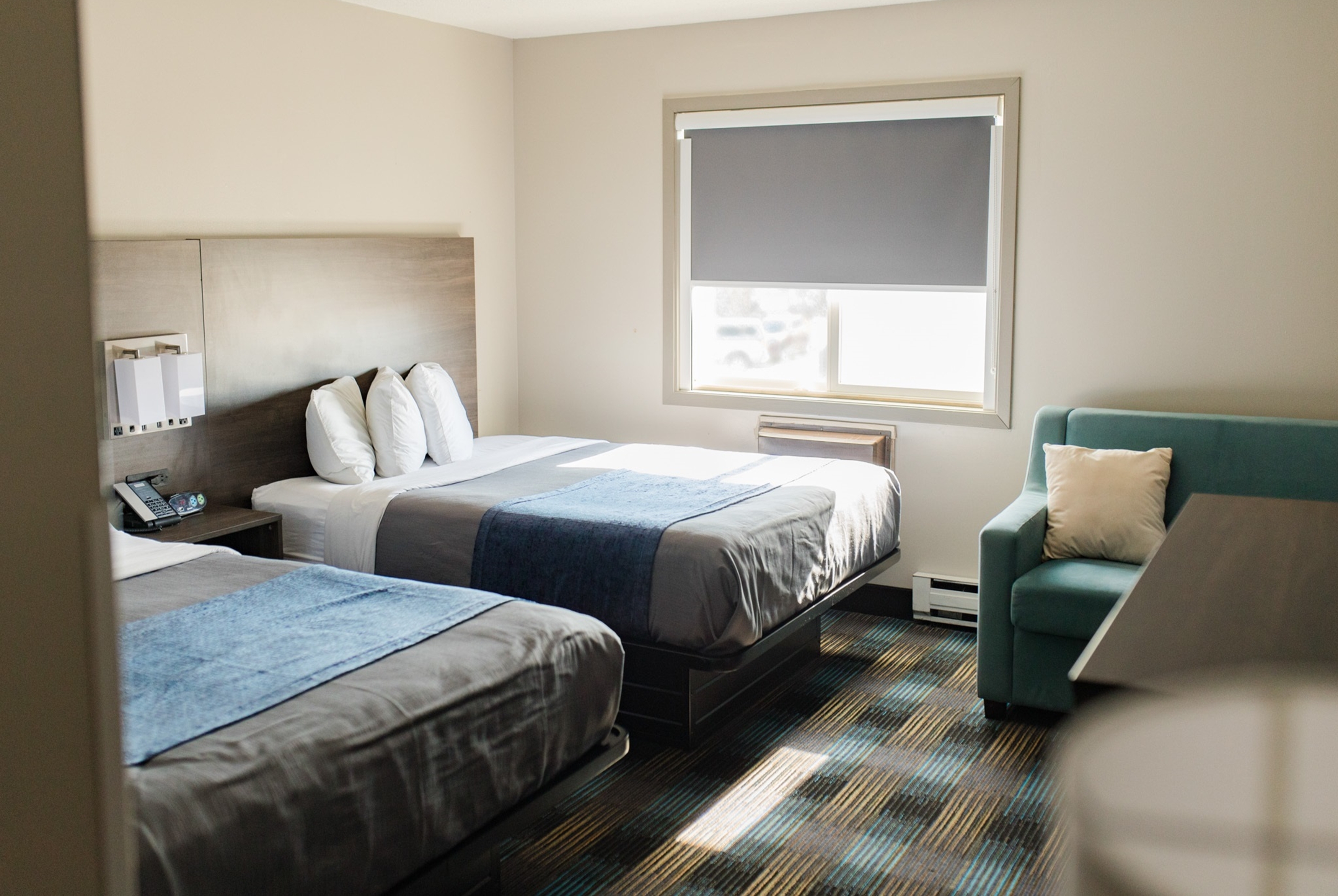 Guest room at the Travelodge by Wyndham Escanaba in Escanaba, Michigan
