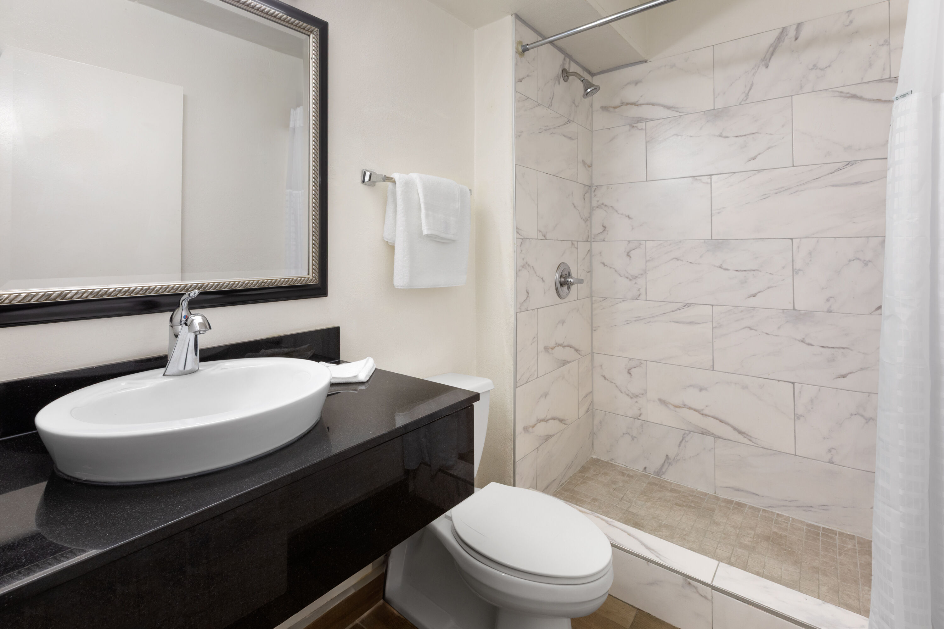 Guest room bath at the Travelodge by Wyndham Madison Heights MI in Madison Heights, Michigan