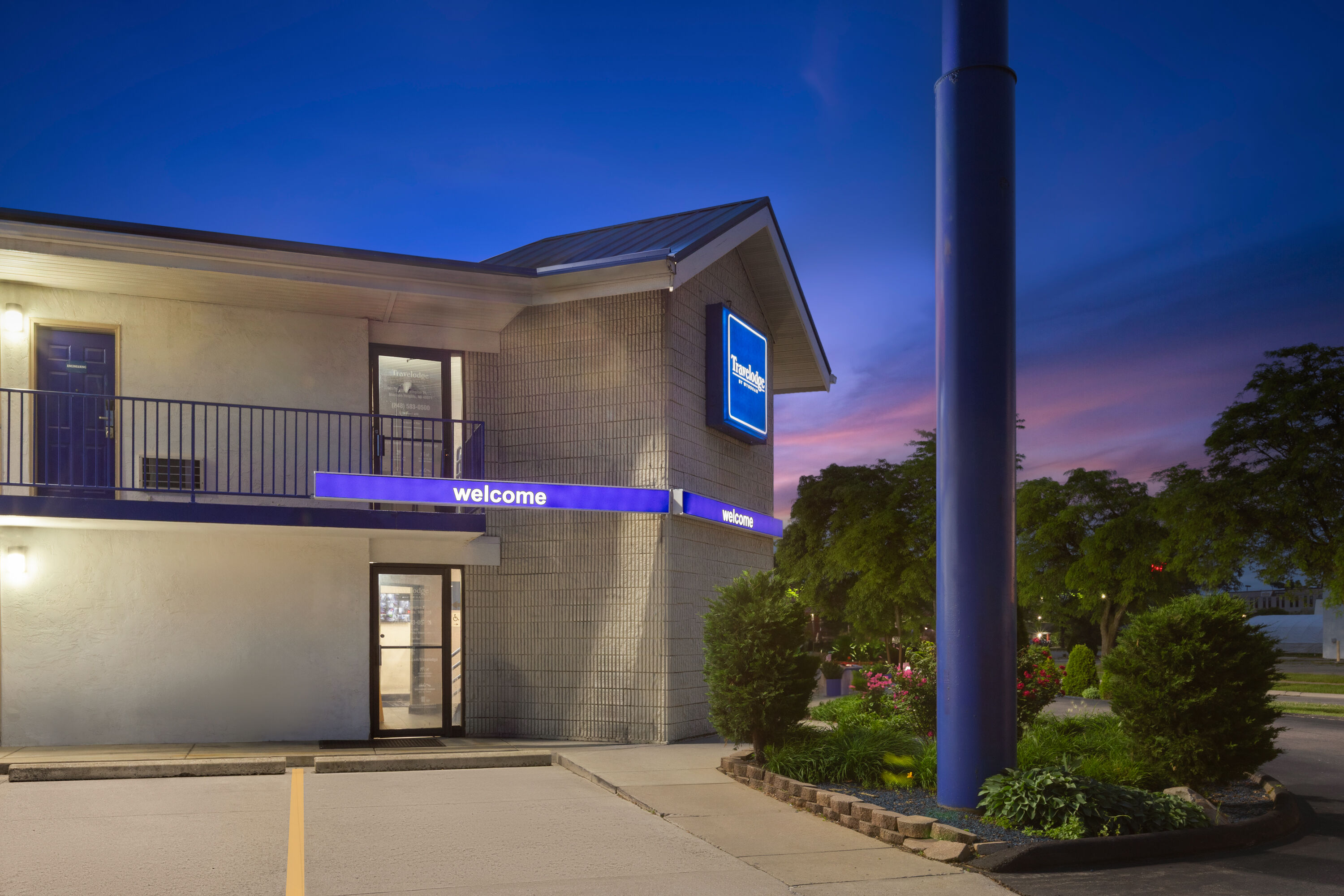 Exterior Dusk Image of Travelodge by Wyndham Madison Heights MI hotel in Madison Heights, Michigan