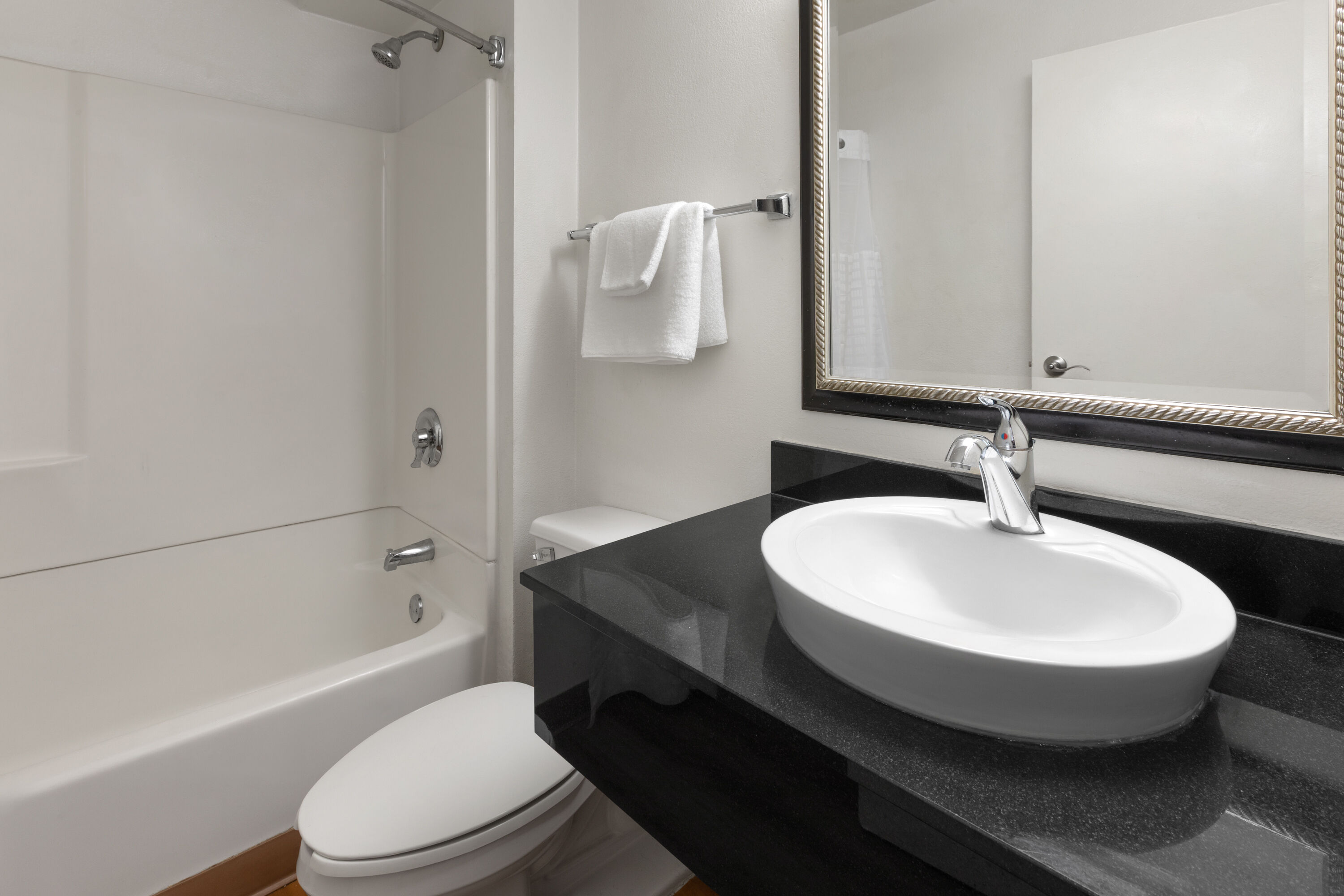 Guest room bath at the Travelodge by Wyndham Madison Heights MI in Madison Heights, Michigan