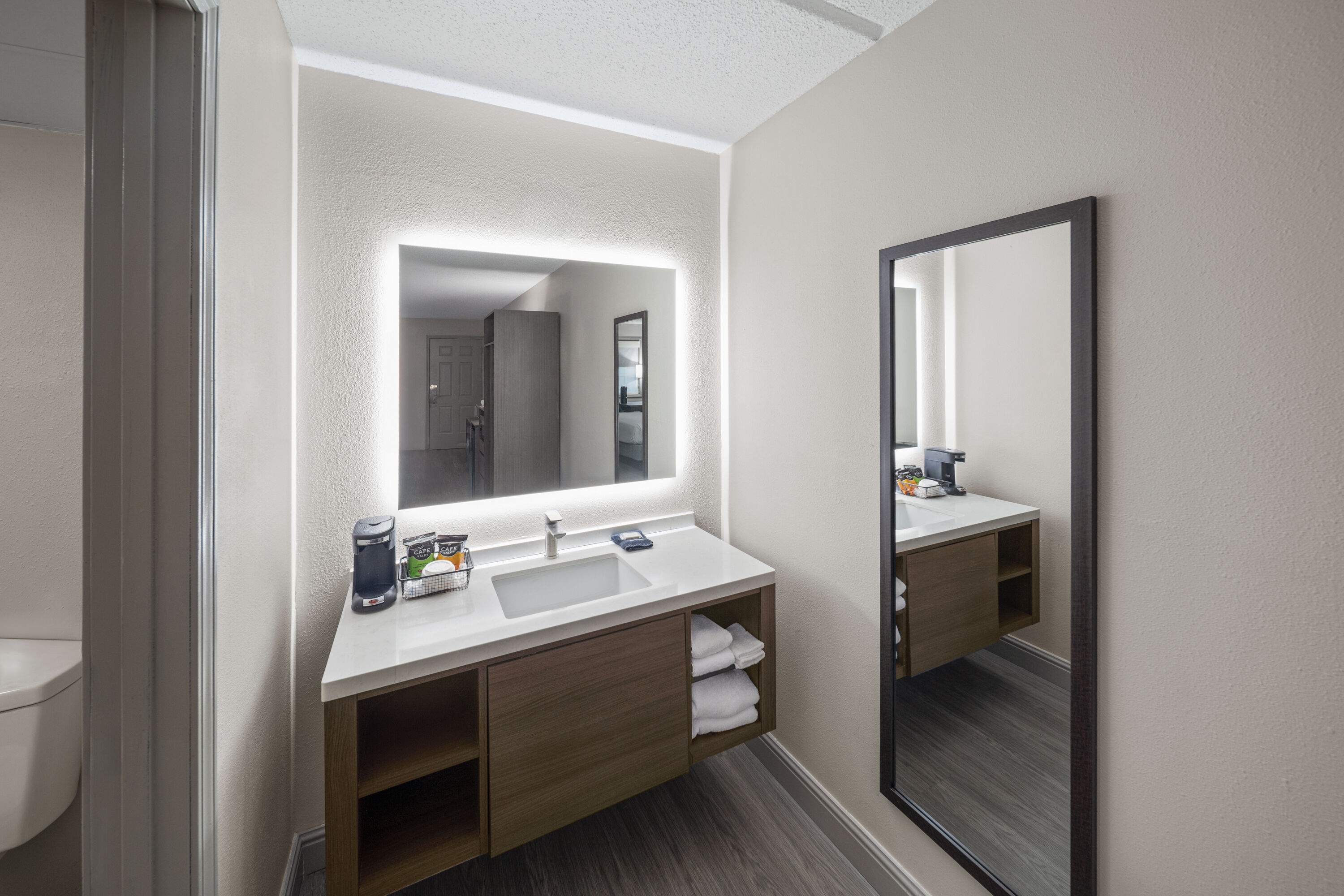 Guest room bath at the Angel Inn Near IMAX, a Travelodge by Wyndham in Branson, Missouri