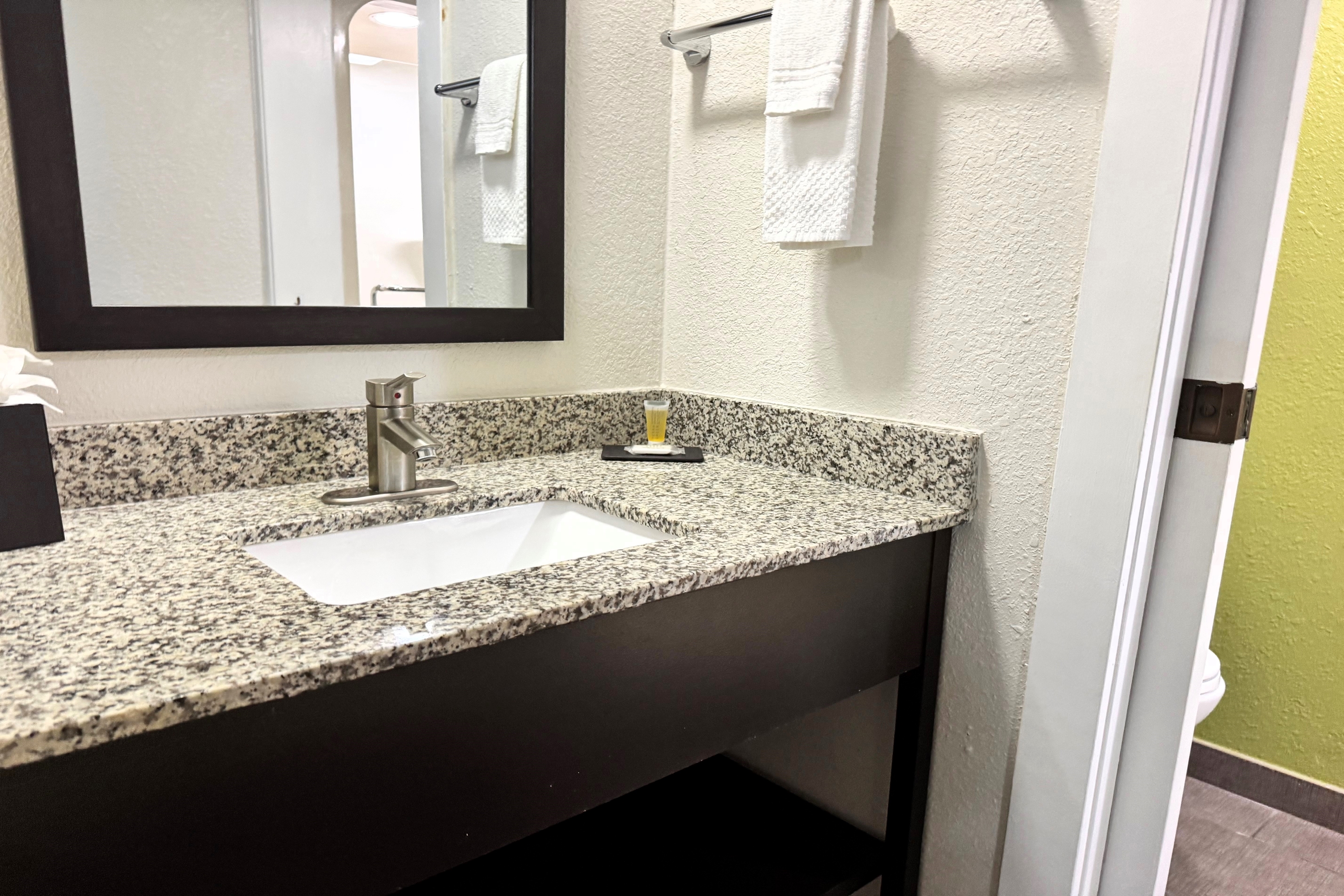 Guest room bath at the Travelodge by Wyndham Flowood/Jackson/Airport North in Flowood, Mississippi