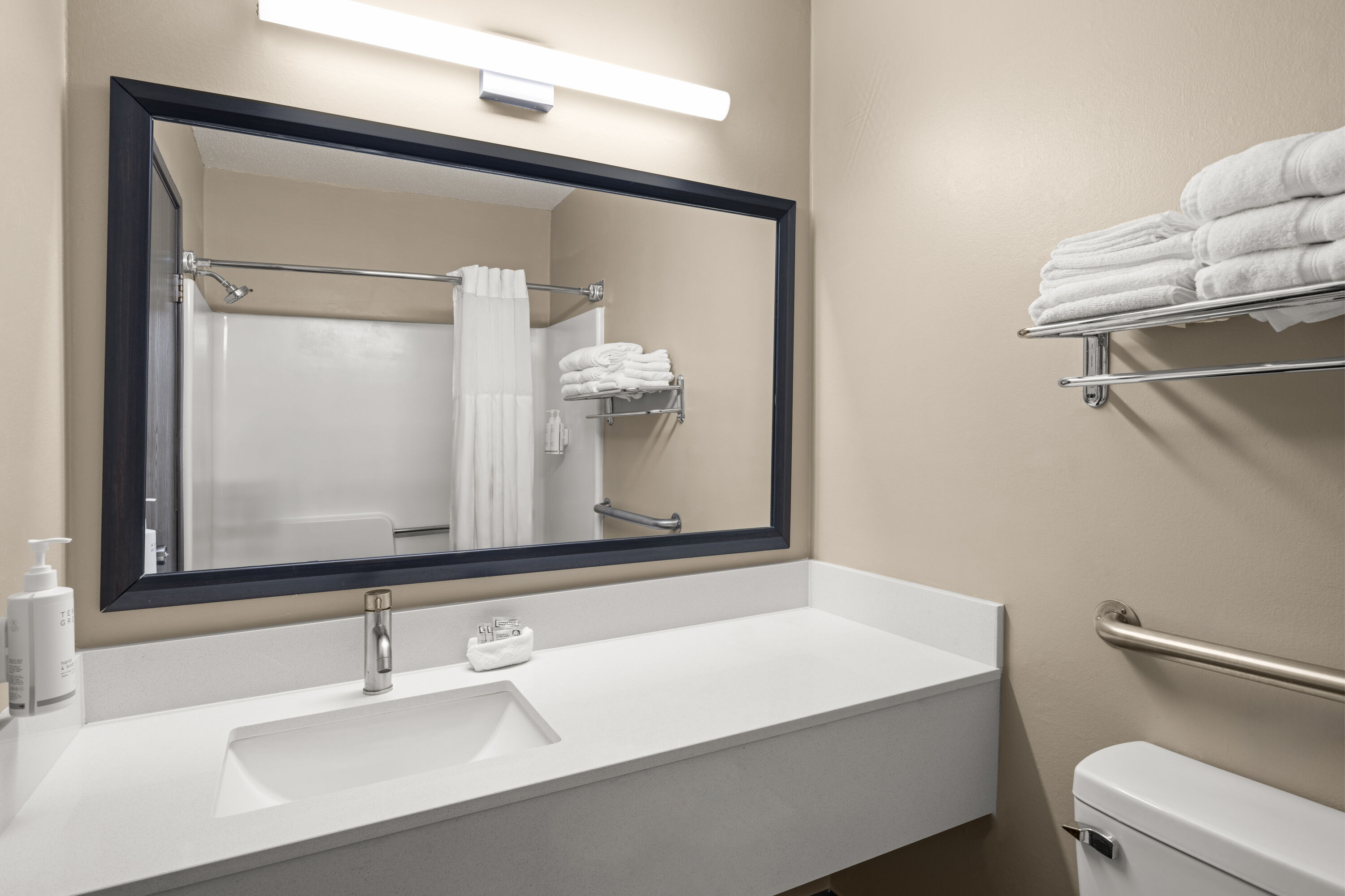 Guest room bath at the Travelodge by Wyndham Fargo West Acres in Fargo, North Dakota