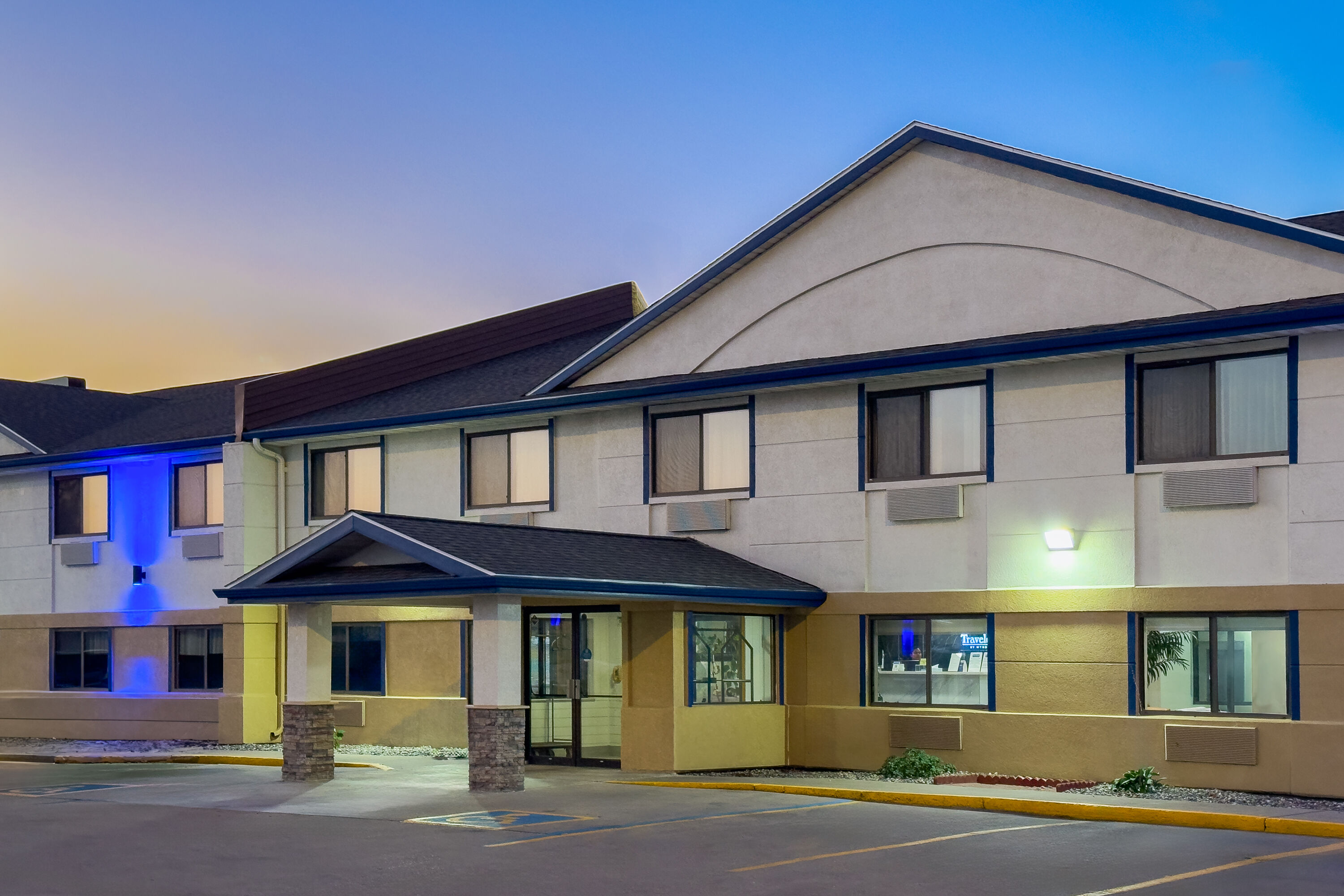 Exterior Dusk Image of Travelodge by Wyndham Fargo West Acres hotel in Fargo, North Dakota