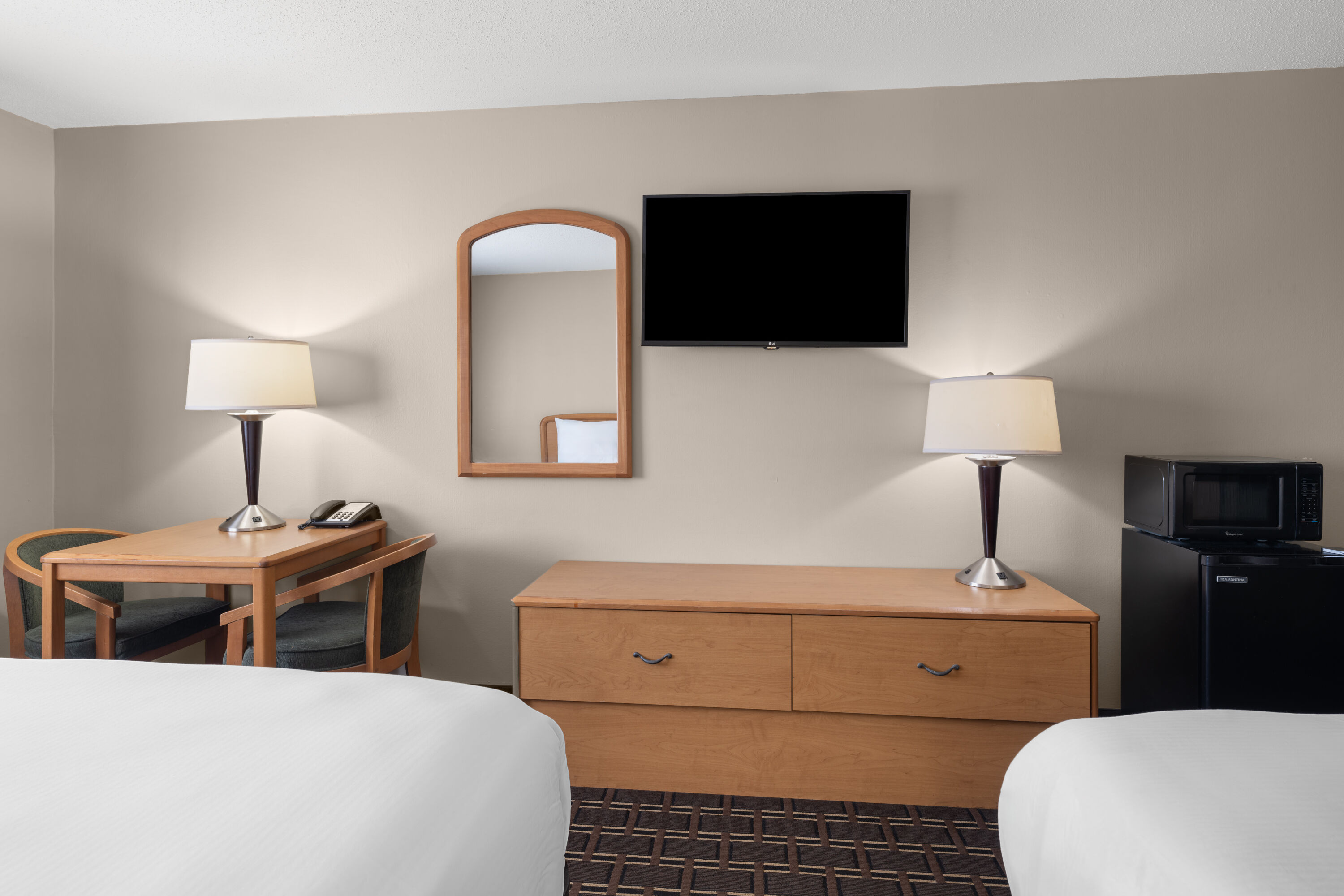 Guest room at the Travelodge by Wyndham Fargo West Acres in Fargo, North Dakota