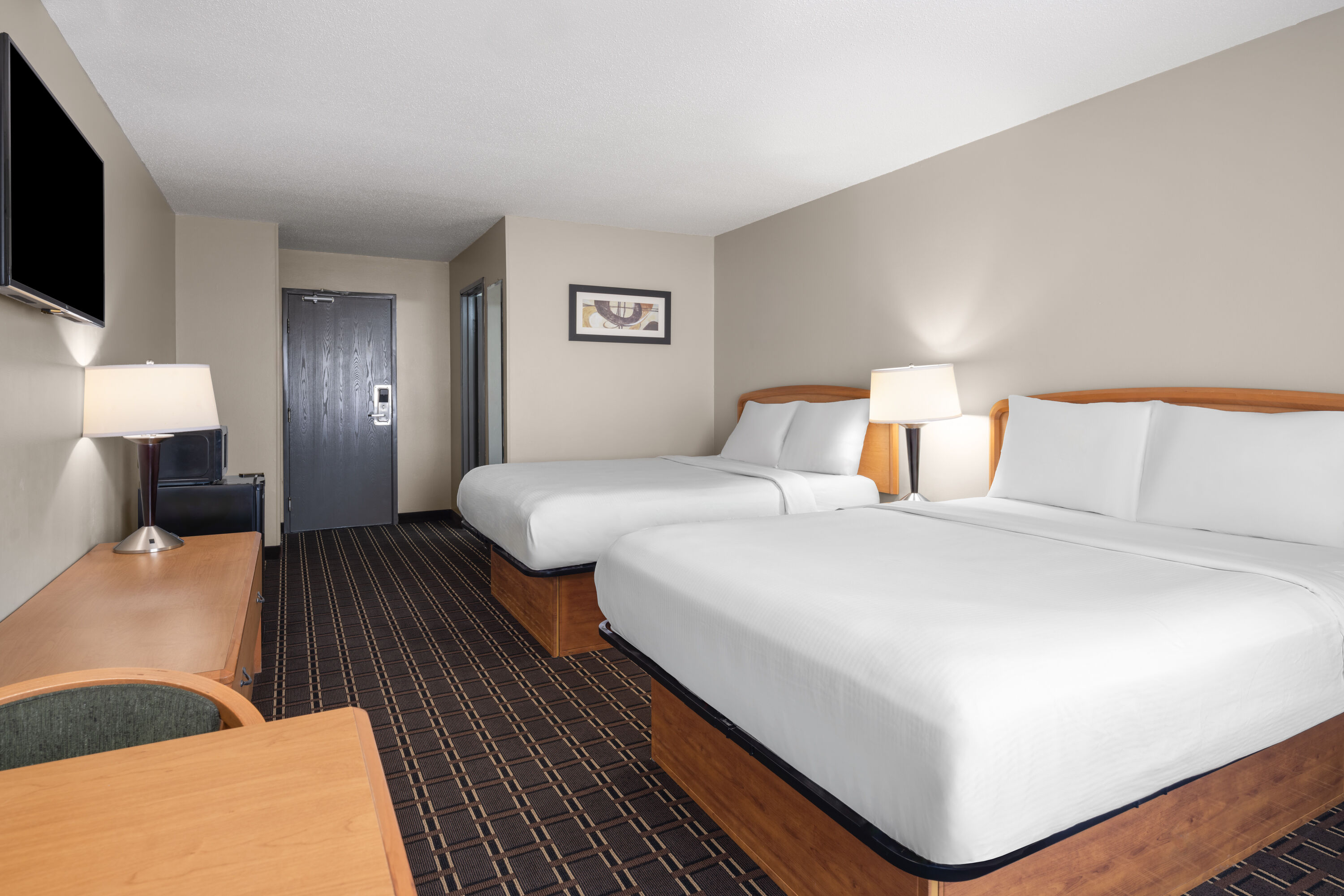 Guest room at the Travelodge by Wyndham Fargo West Acres in Fargo, North Dakota