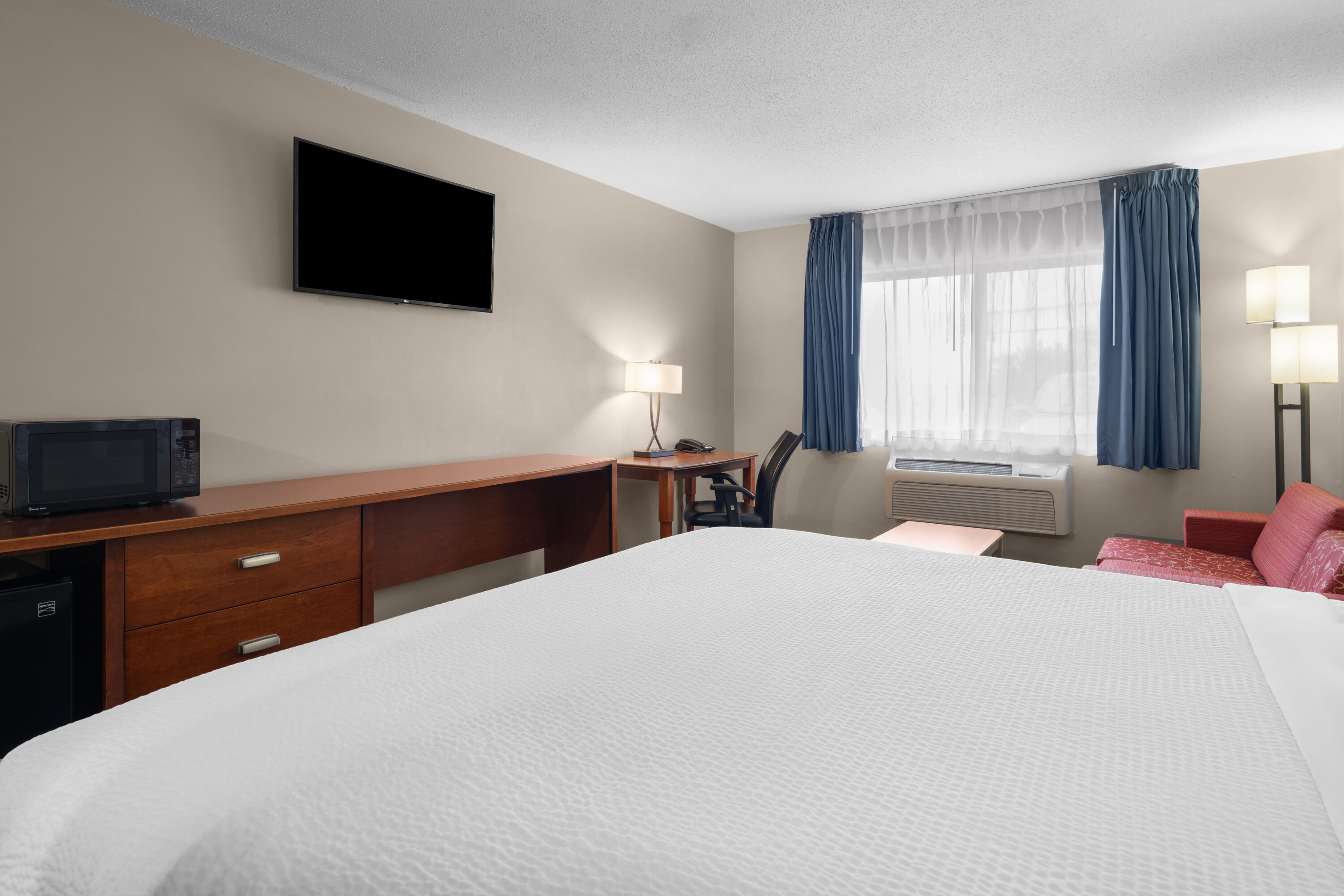 Guest room at the Travelodge by Wyndham Fargo West Acres in Fargo, North Dakota