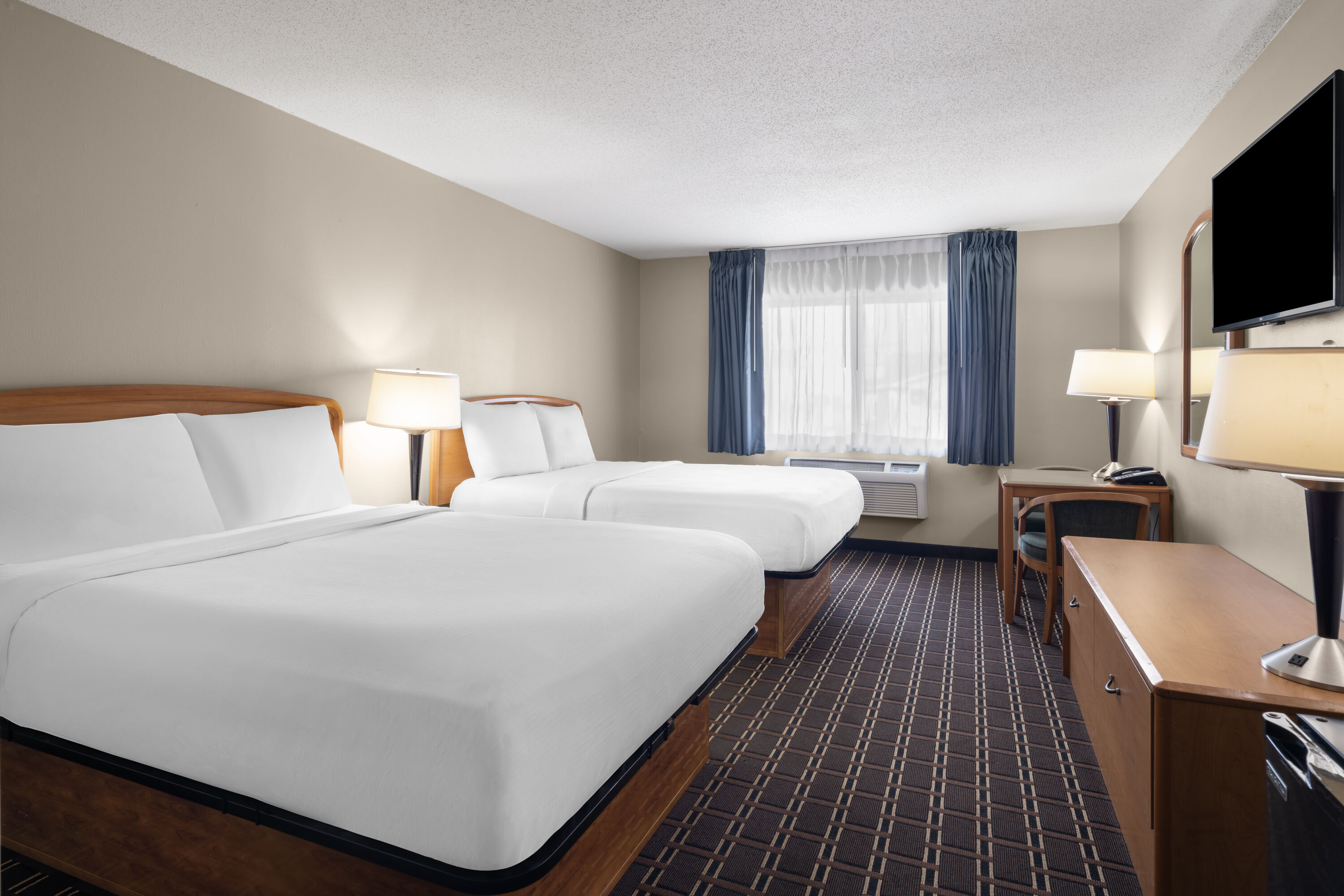 Guest room at the Travelodge by Wyndham Fargo West Acres in Fargo, North Dakota