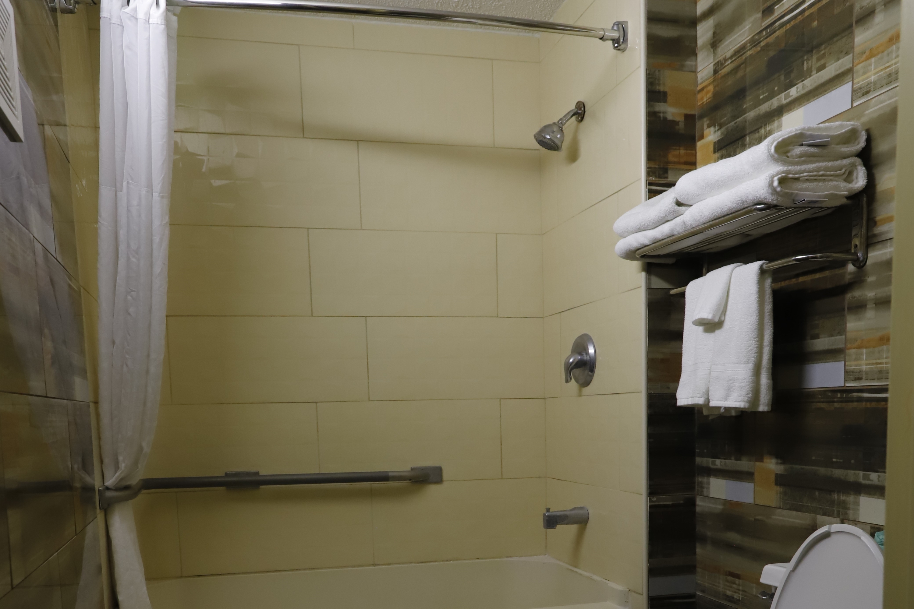 Guest room bath at the Travelodge by Wyndham Parsippany in Parsippany, New Jersey