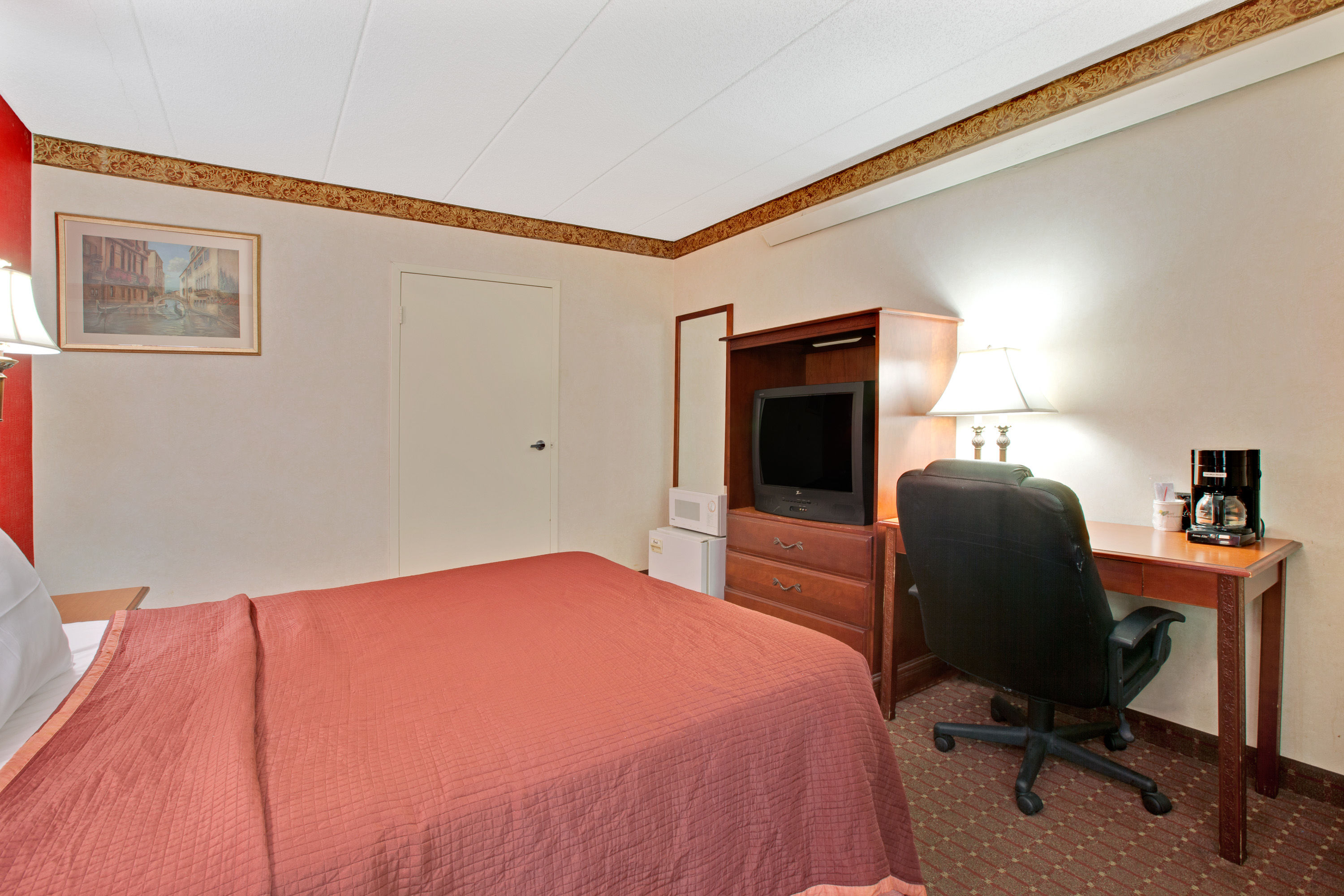 Guest room at the Travelodge by Wyndham Parsippany in Parsippany, New Jersey