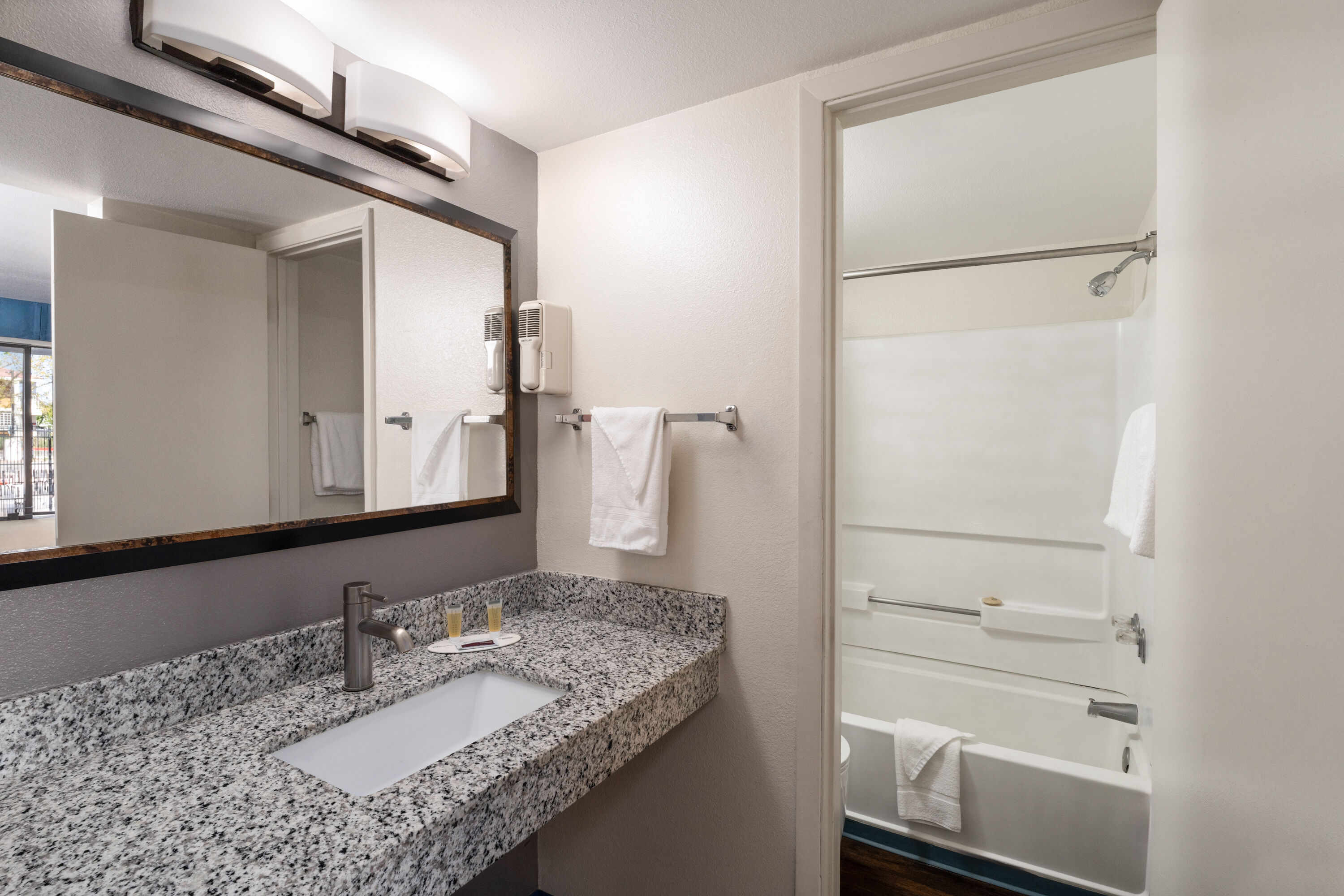 Guest room bath at the Travelodge by Wyndham Albuquerque West in Albuquerque, New Mexico