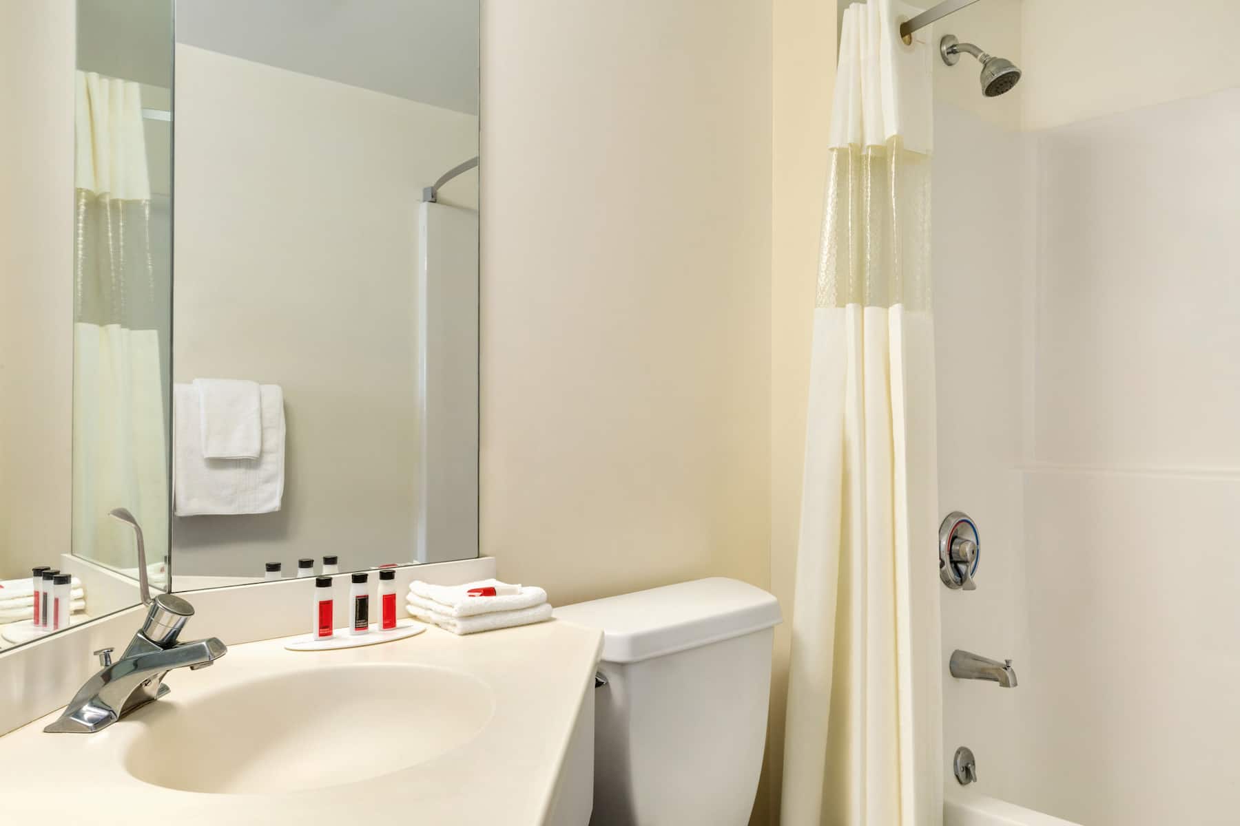 Guest room bath at the Travelodge by Wyndham Niagara Falls in Niagara Falls, New York