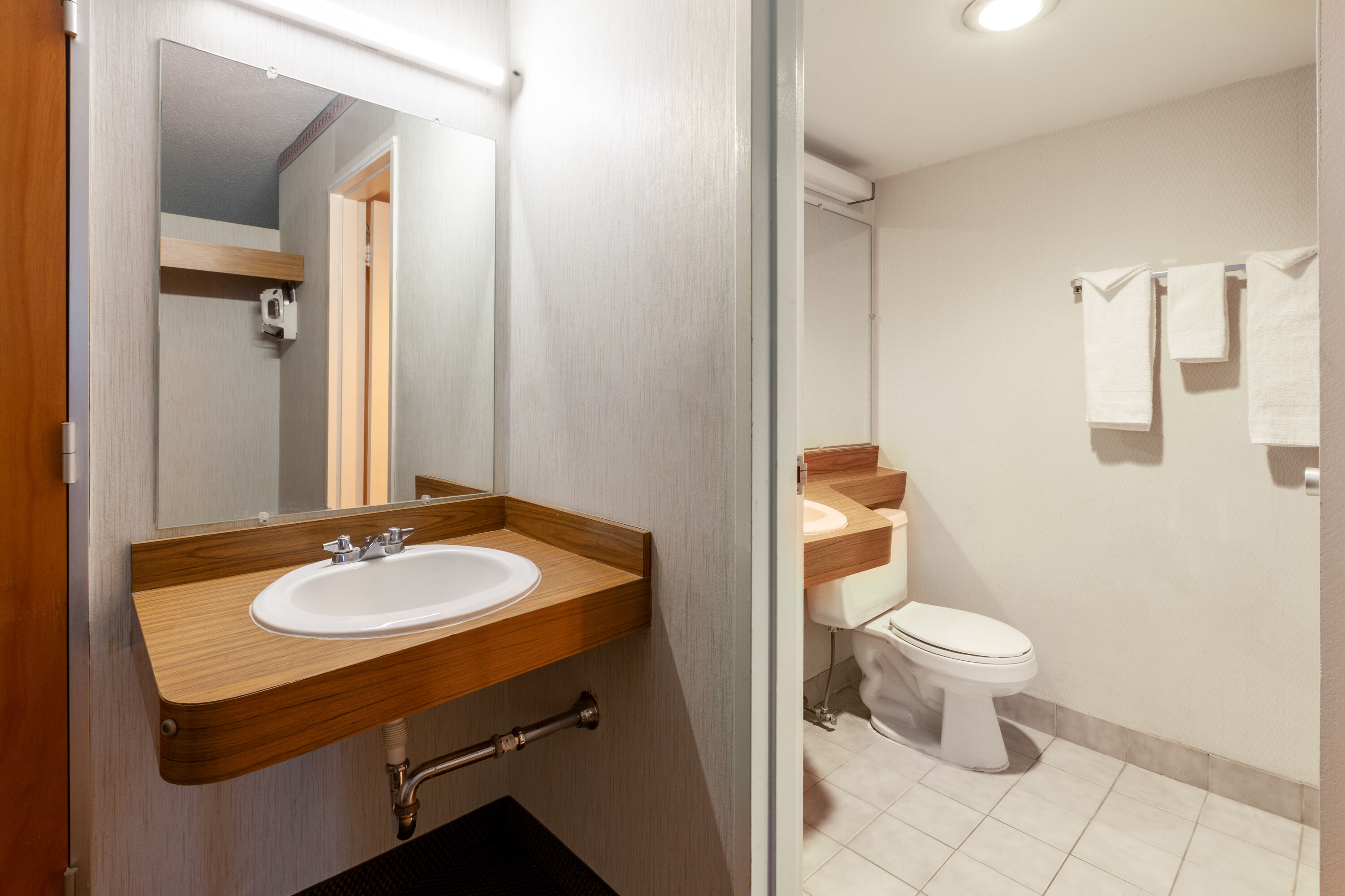 Guest room bath at the Travelodge by Wyndham Cleveland Airport in Brook Park, Ohio