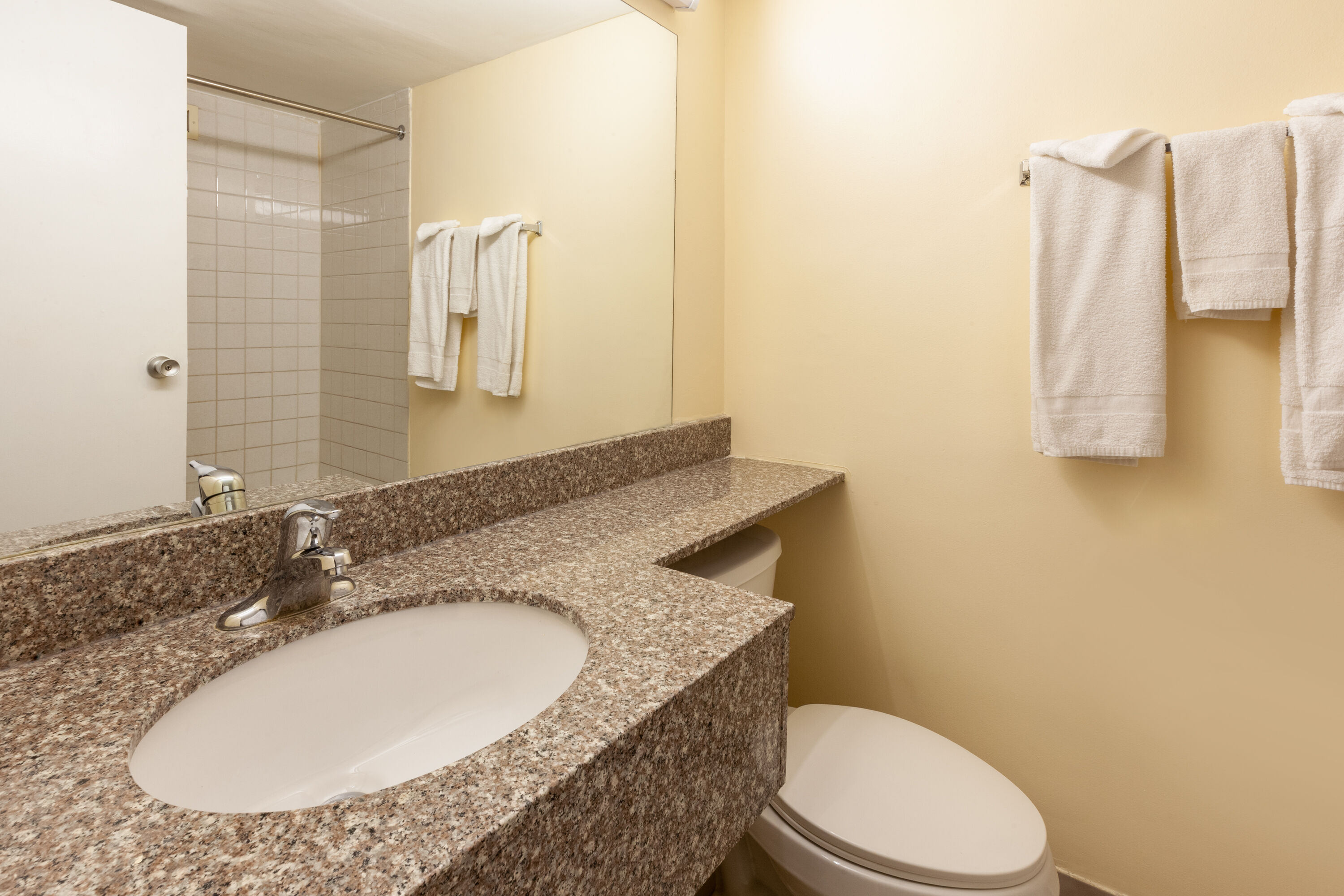 Guest room bath at the Travelodge by Wyndham Cleveland Airport in Brook Park, Ohio