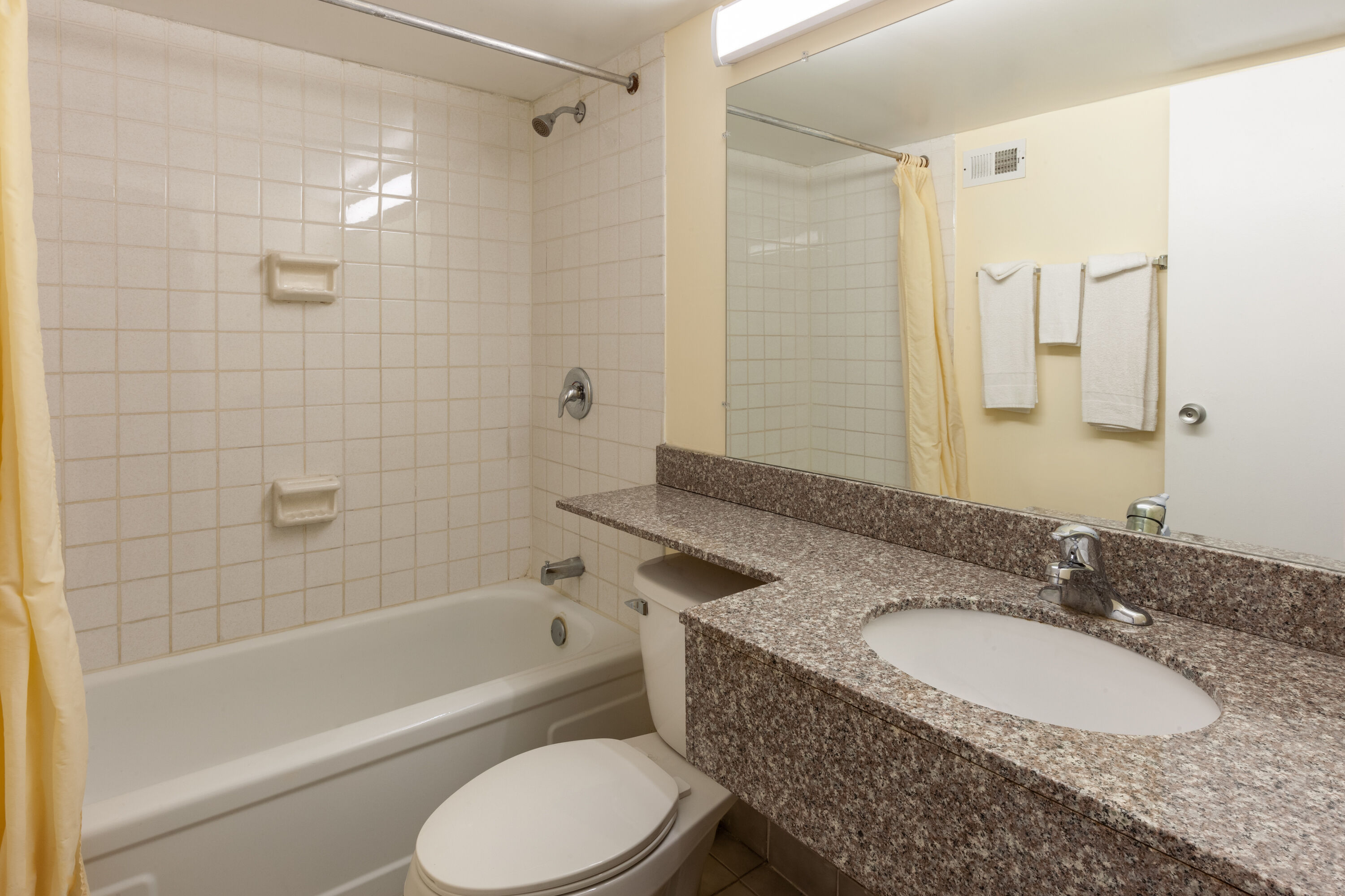 Guest room bath at the Travelodge by Wyndham Cleveland Airport in Brook Park, Ohio