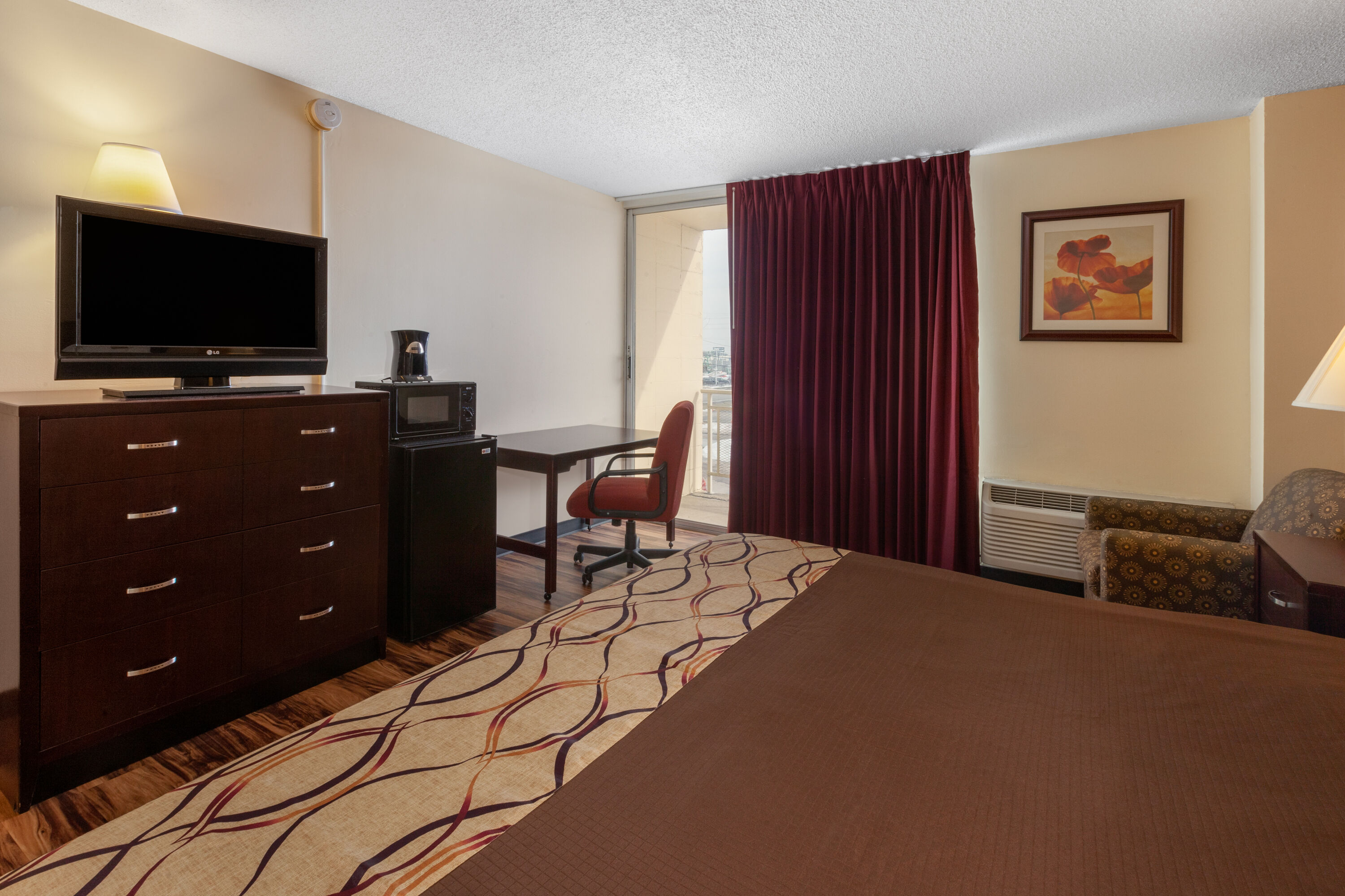Guest room at the Travelodge by Wyndham Cleveland Airport in Brook Park, Ohio