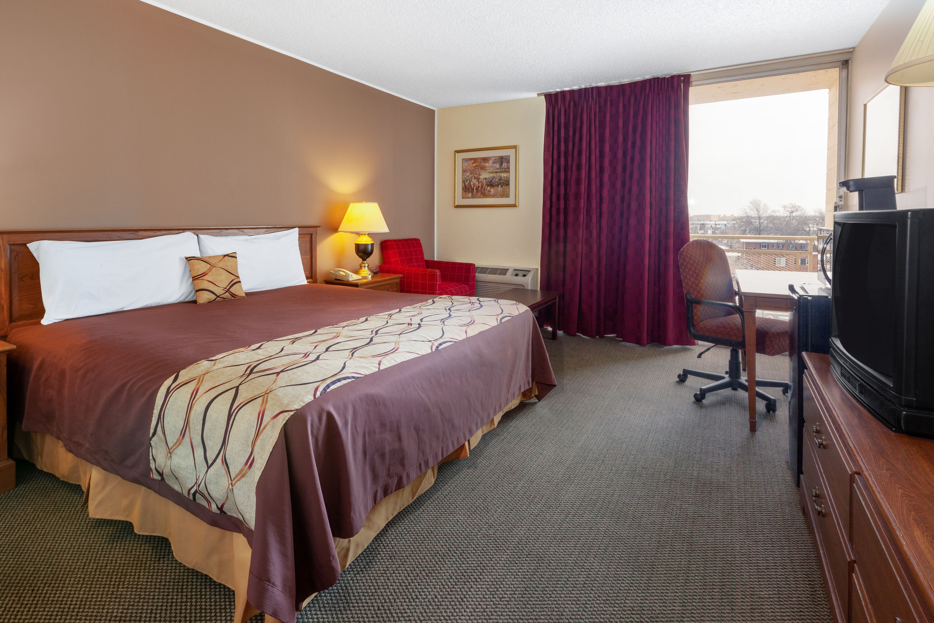 Guest room at the Travelodge by Wyndham Cleveland Airport in Brook Park, Ohio