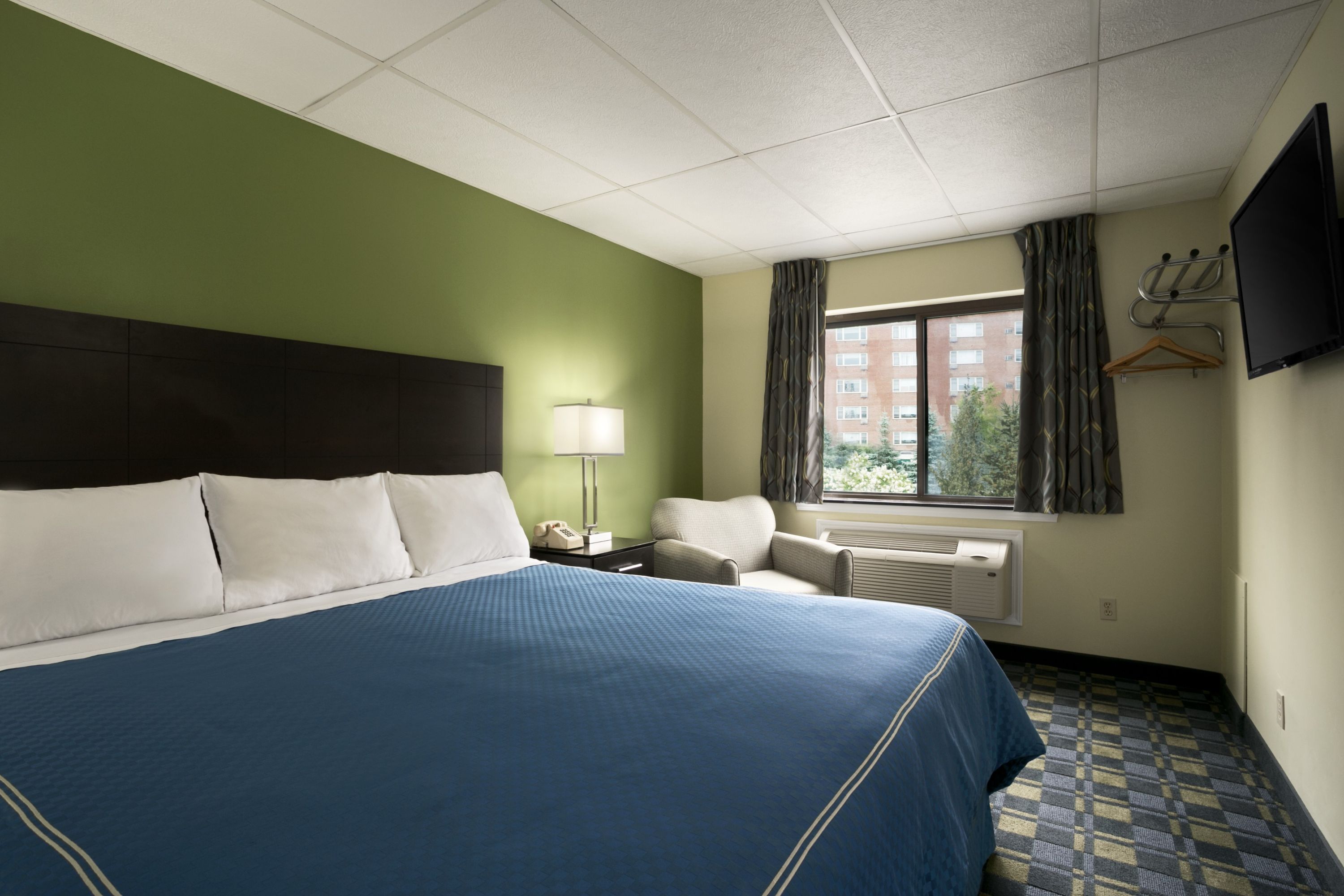 Guest room at the Travelodge by Wyndham Cleveland Lakewood in Lakewood, Ohio