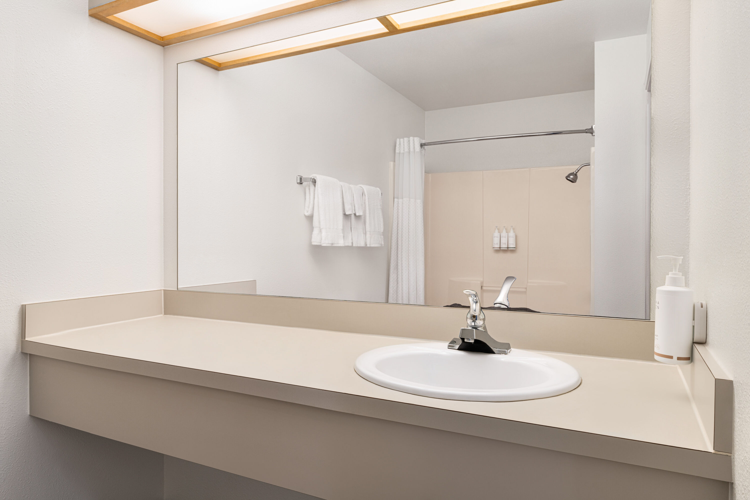 Guest room bath at the Travelodge by Wyndham Depoe Bay in Depoe Bay, Oregon