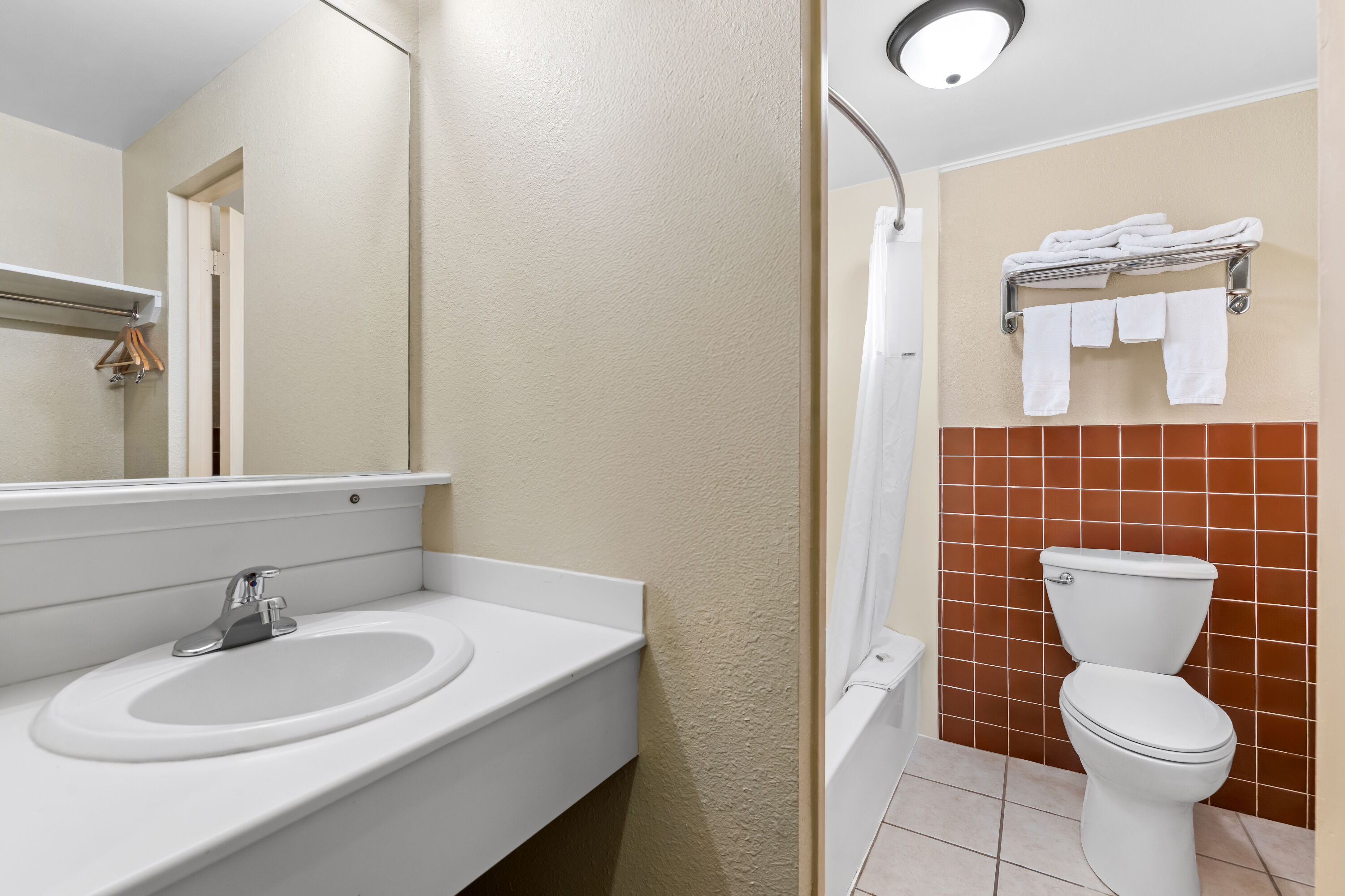 Guest room bath at the Travelodge by Wyndham Rapid City in Rapid City, South Dakota