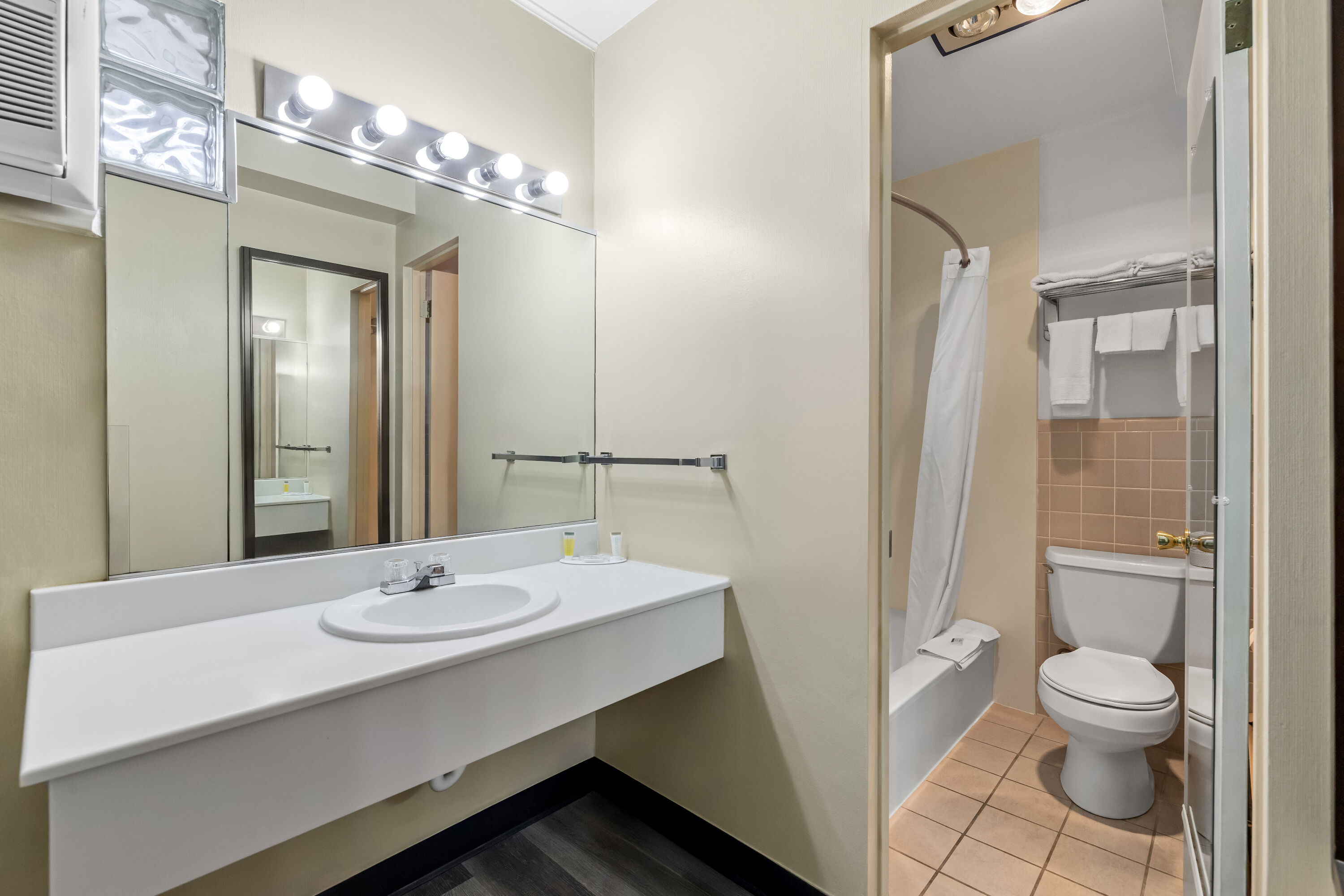 Guest room bath at the Travelodge by Wyndham Rapid City in Rapid City, South Dakota