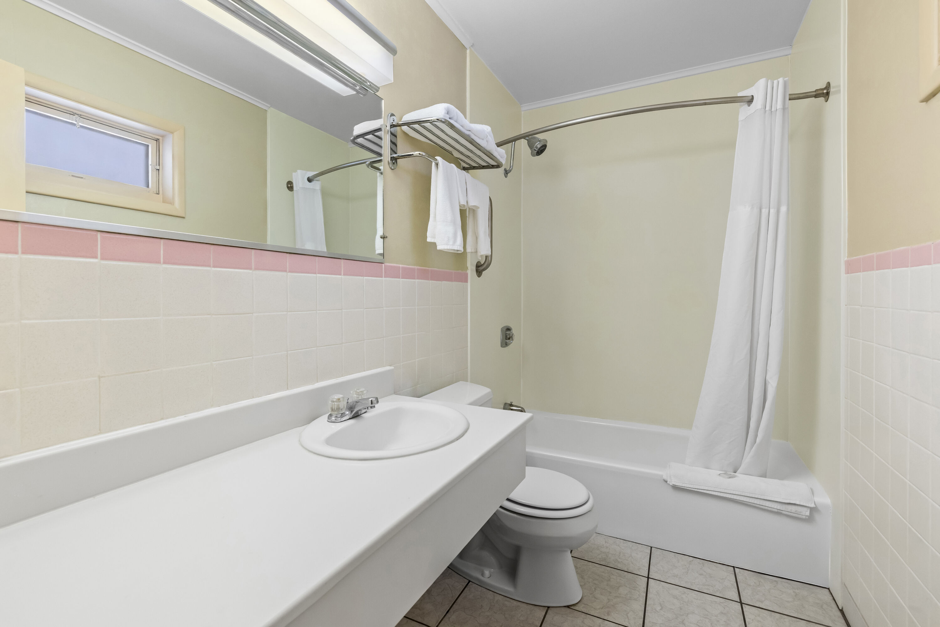 Guest room bath at the Travelodge by Wyndham Rapid City in Rapid City, South Dakota