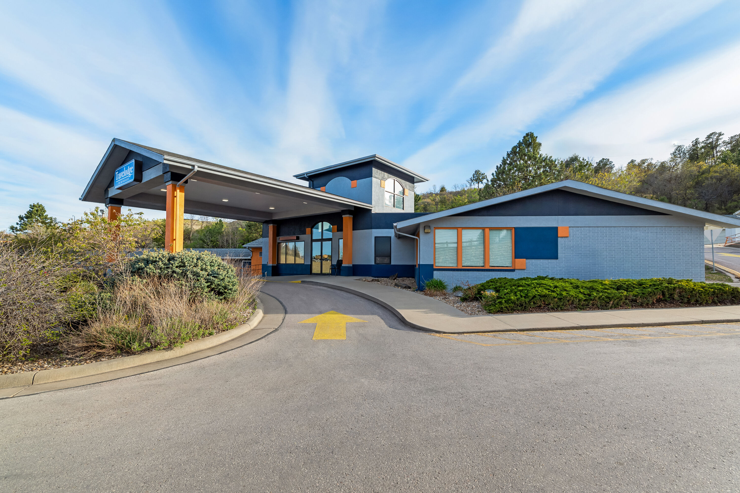 Exterior Day Image of Travelodge by Wyndham Rapid City hotel in Rapid City, South Dakota