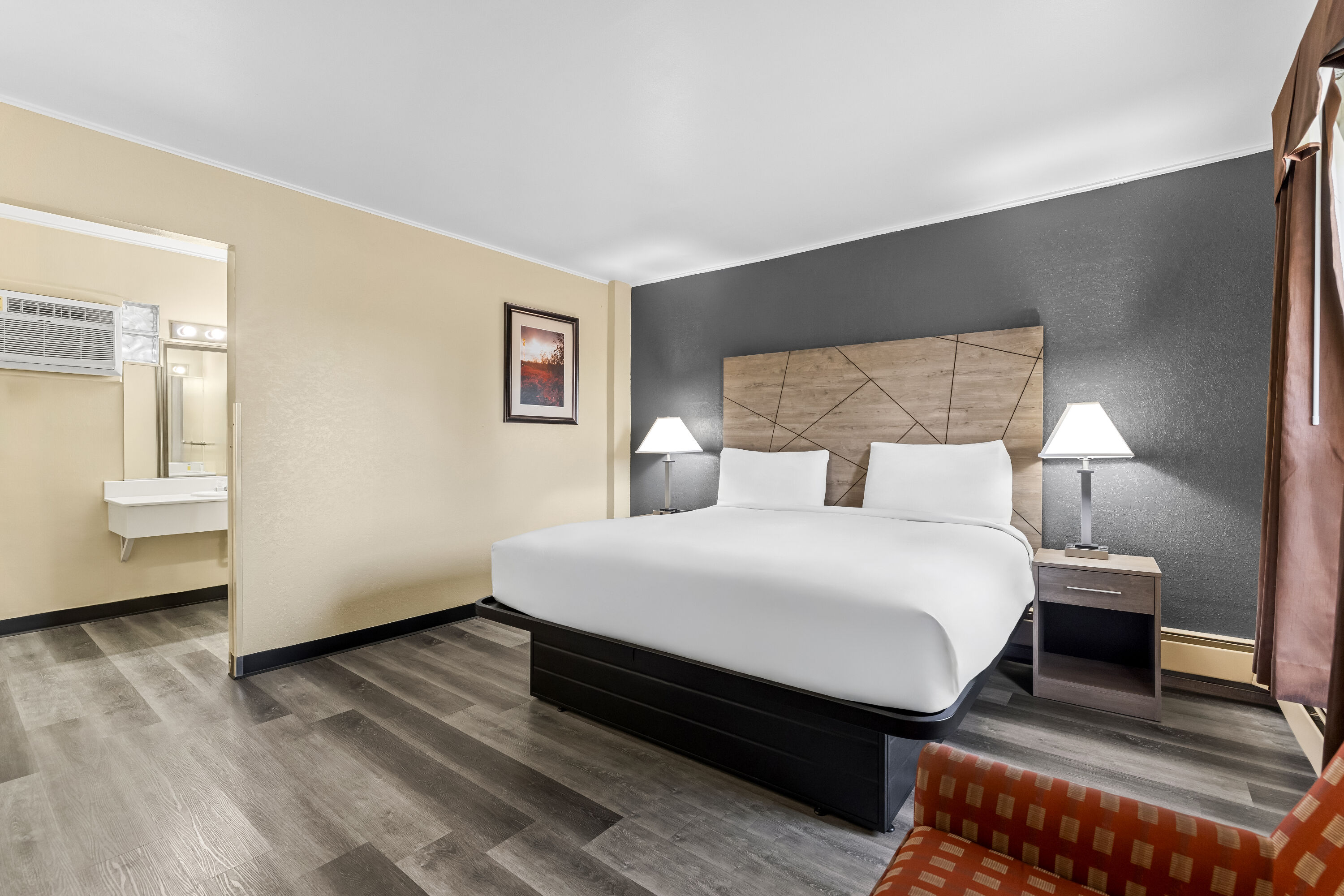 King bed guest room at the Travelodge by Wyndham Rapid City in Rapid City, South Dakota