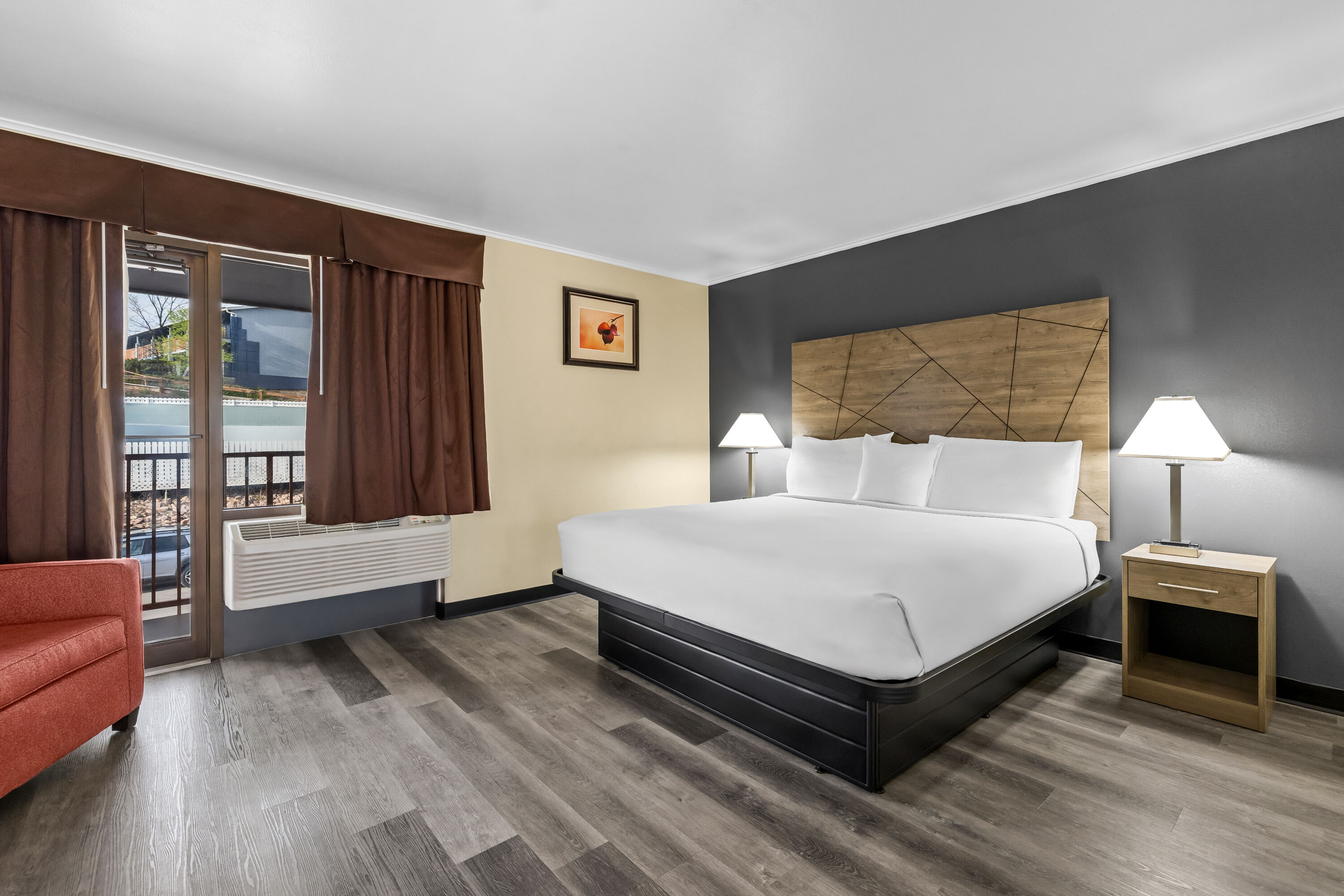 King bed guest room at the Travelodge by Wyndham Rapid City in Rapid City, South Dakota
